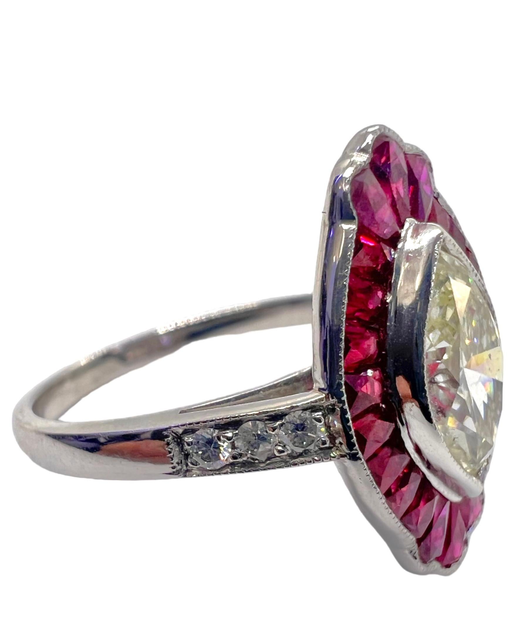 Platinum ring with 1.00 carat marquise cut center diamond 0.18 carat small round diamonds and 2.07 carat of rubies.

Sophia D by Joseph Dardashti LTD has been known worldwide for 35 years and are inspired by classic Art Deco design that merges with