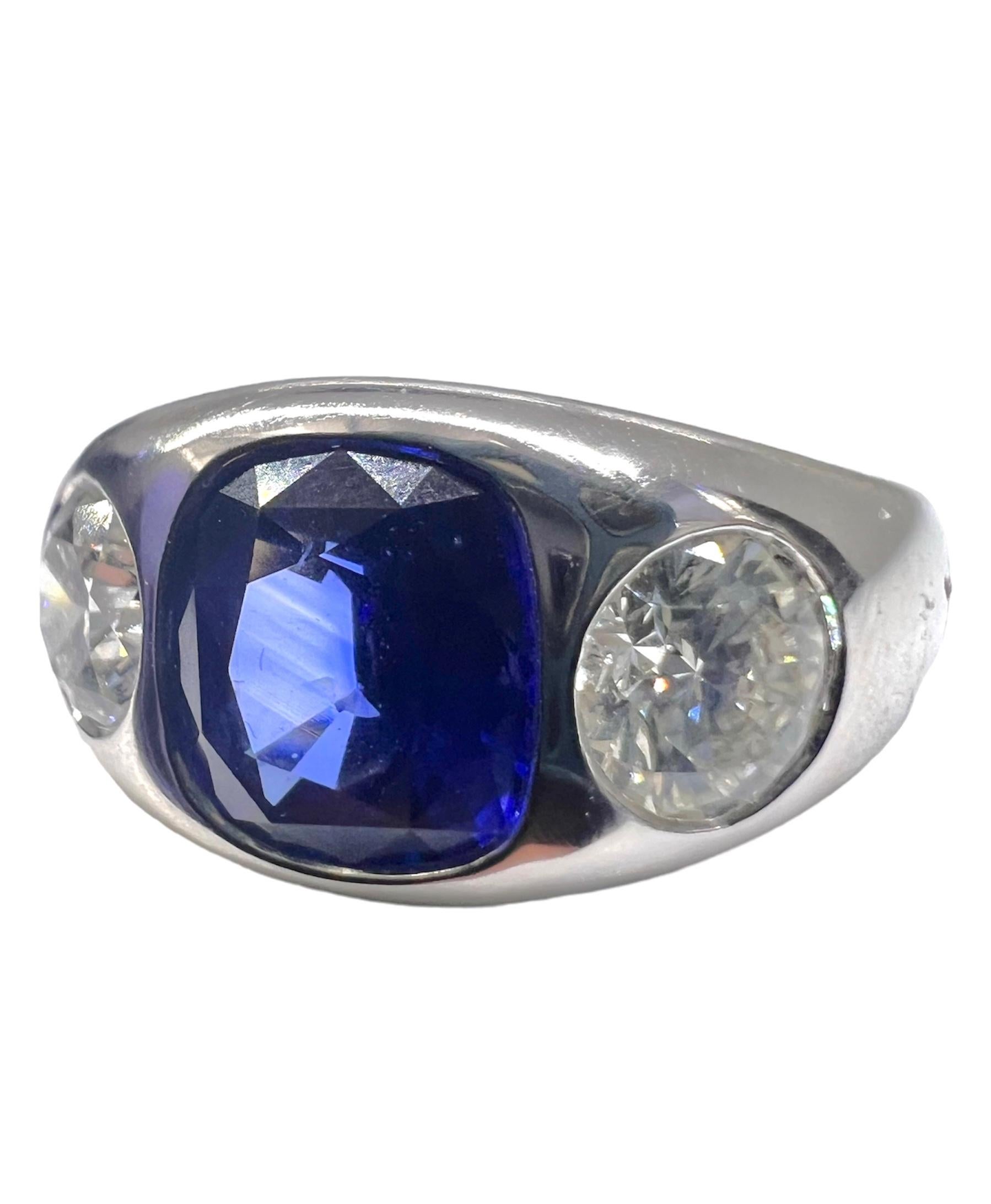 A triple stone gypsy ring with a GIA certified round diamonds that weighs 0.53 carat and 0.51 carat and cushion cut blue sapphire that weighs2.12 carat set in platinum.

Sophia D by Joseph Dardashti LTD has been known worldwide for 35 years and are