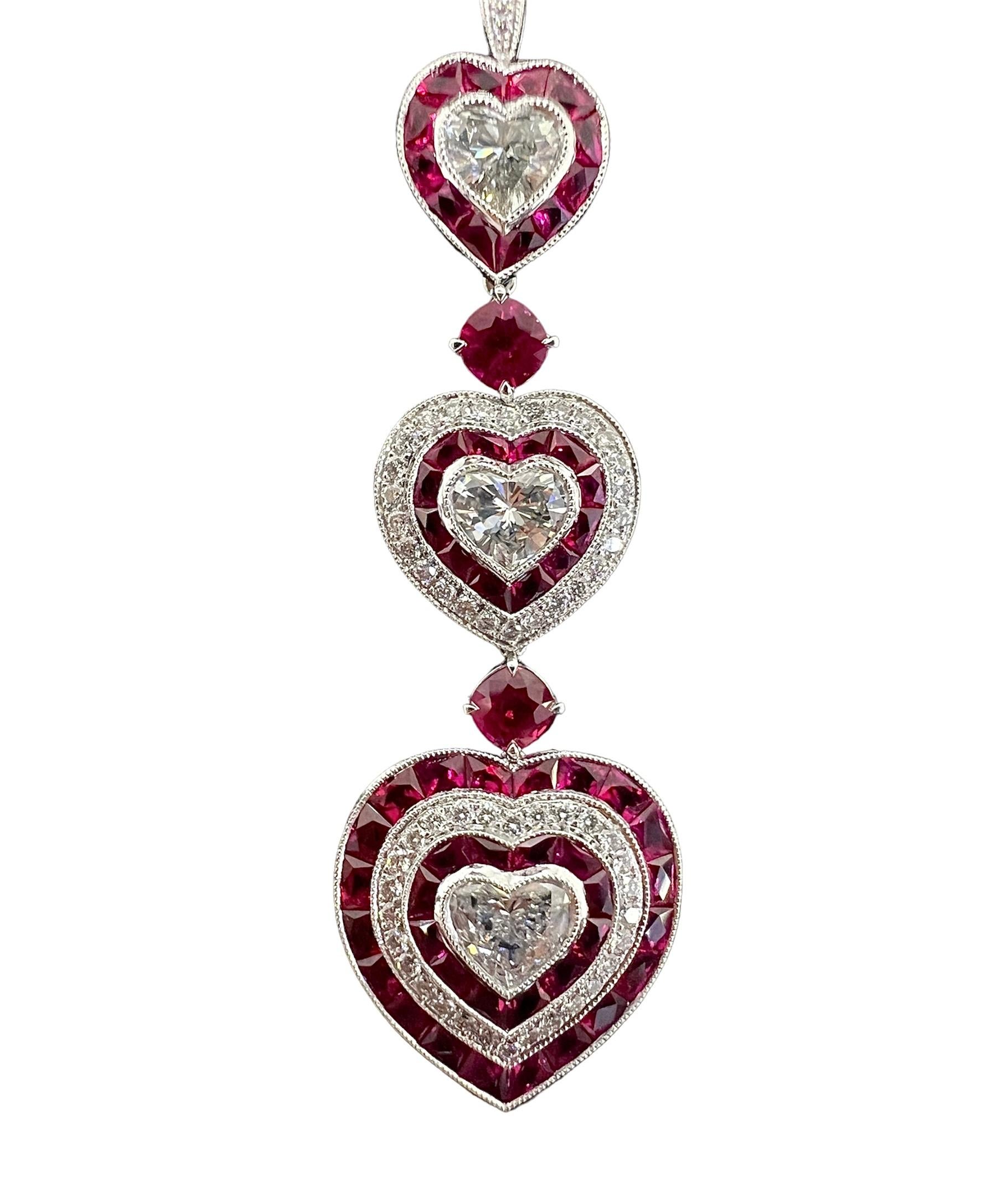 A platinum pendant necklace with 1.49 carat heart shaped cut diamond accentuated with 0.46 carat of round diamonds and 0.73 and 3.12 carat of rubies.

Sophia D by Joseph Dardashti LTD has been known worldwide for 35 years and are inspired by classic