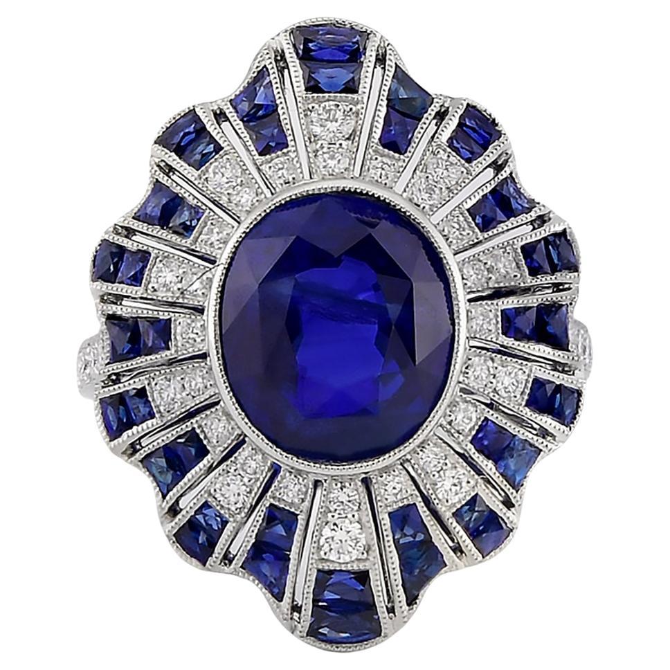 Anello D. A. con zaffiro ovale e diamanti in platino in vendita