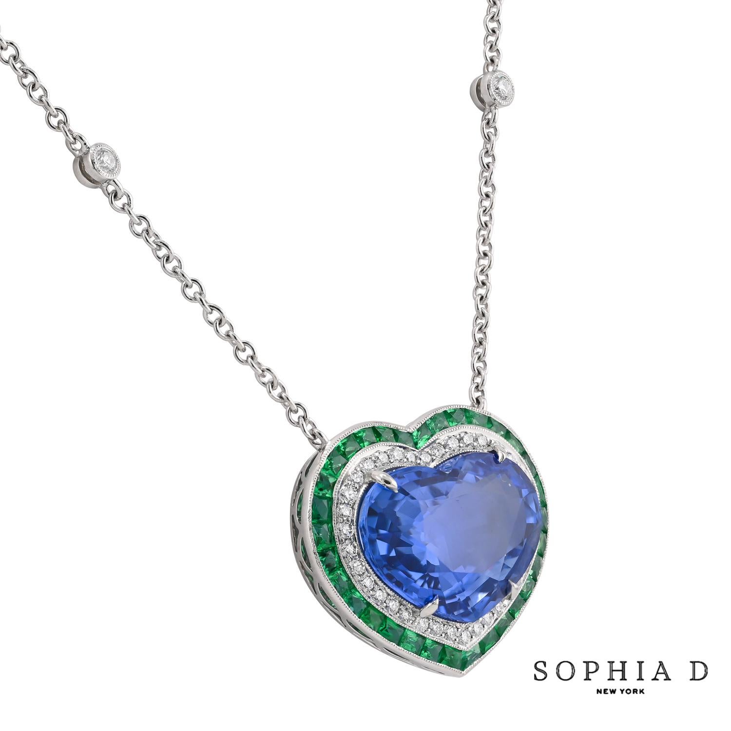 This exquisite platinum necklace features a stunning 10.57ct heart-shaped sapphire at its center, beautifully surrounded by 0.67ct of emeralds and 0.44ct of diamonds. The combination of vibrant colors and the elegant heart-shaped design creates a