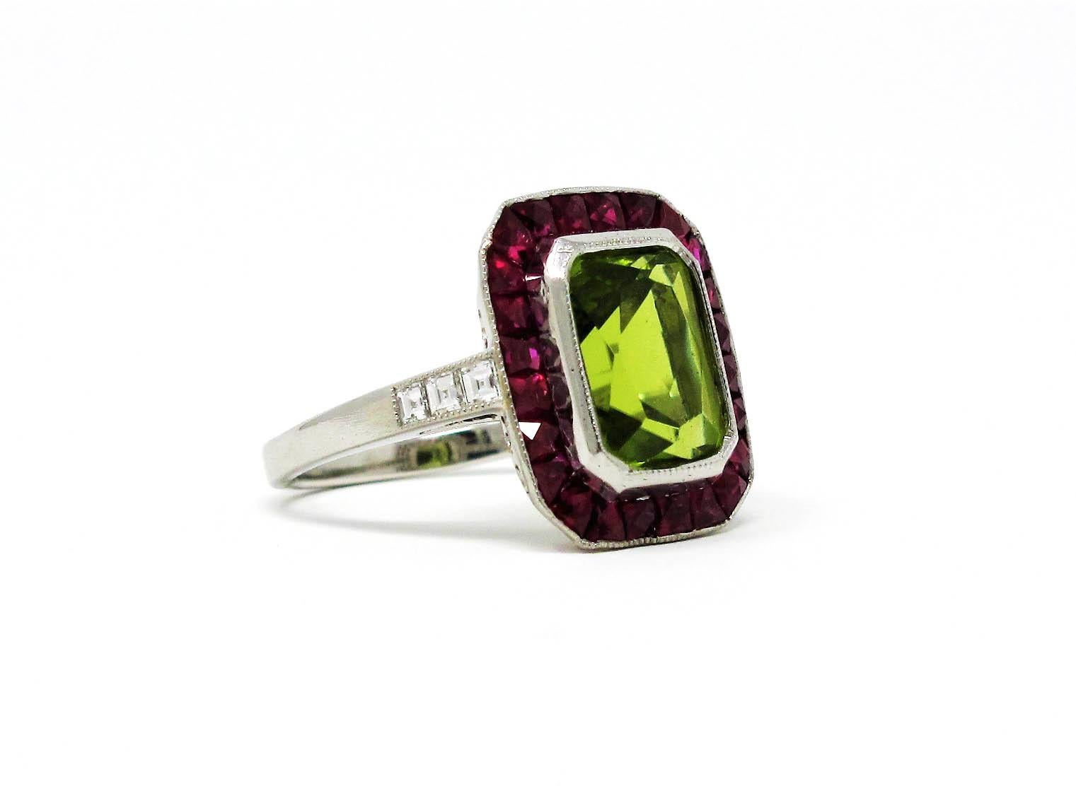 Gorgeous, brightly colored custom cocktail ring from the Sophia D. Collection.  This unique piece features a sparkling 2.55 carat cut-cornered rectangular peridot stone in a bright lime green color, bezel set at the center of the size 5 ring. A bold