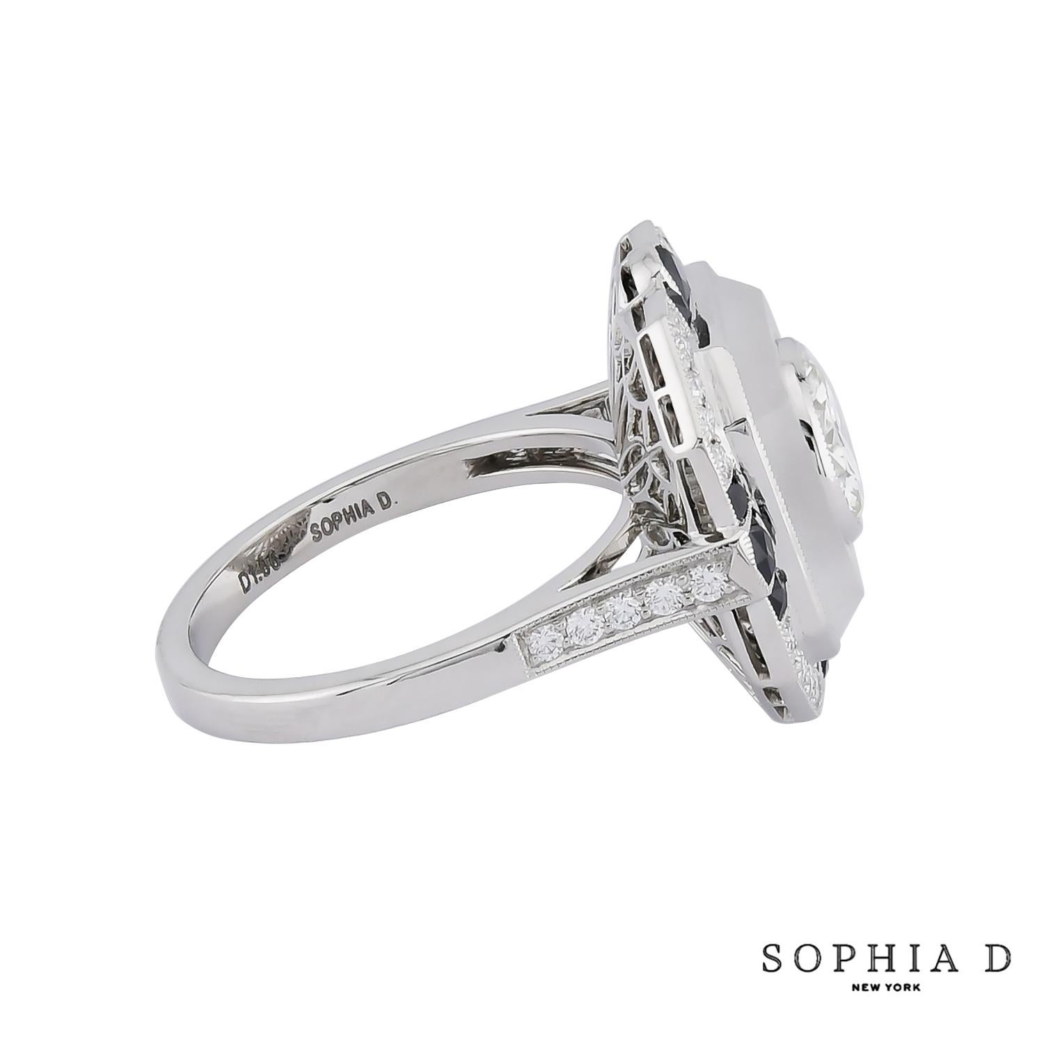 A Sophia D Art Deco style ring that features a striking rock crystal center and a 3.32 carat round center diamond , enhanced by a .58 CT onyx and 1.06 CT of round diamonds. Set in platinum.

Sophia D has been known world-wide for over 40 years