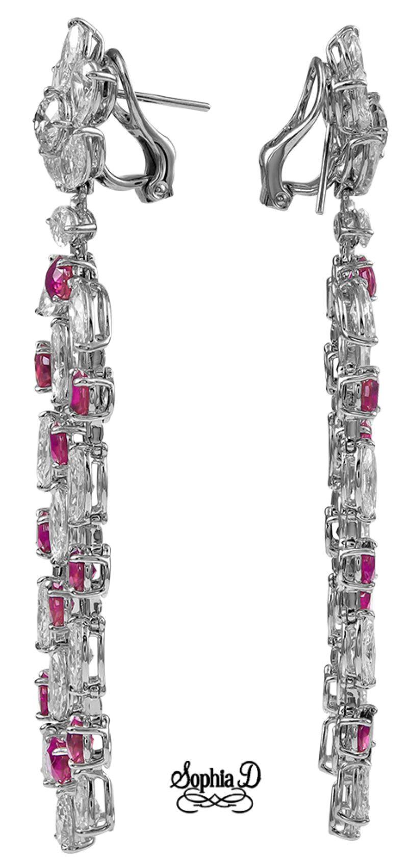 Platinum earrings by Sophia D. that features a 12.46 carats of rubies and 17.21 carats of diamonds. 

Sophia D by Joseph Dardashti LTD has been known worldwide for 35 years and are inspired by classic Art Deco design that merges with modern