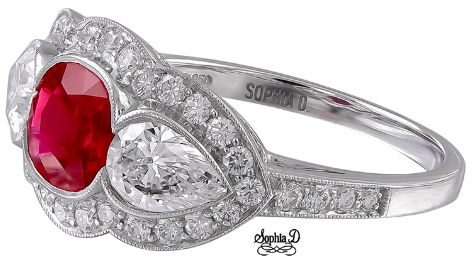 A three stone ring with 0.92 carat cushion cut center ruby flanked with 1.03 carat pear shaped diamond and accentuated with 0.43 carat small diamonds set in platinum.

Sophia D by Joseph Dardashti LTD has been known worldwide for 35 years and are