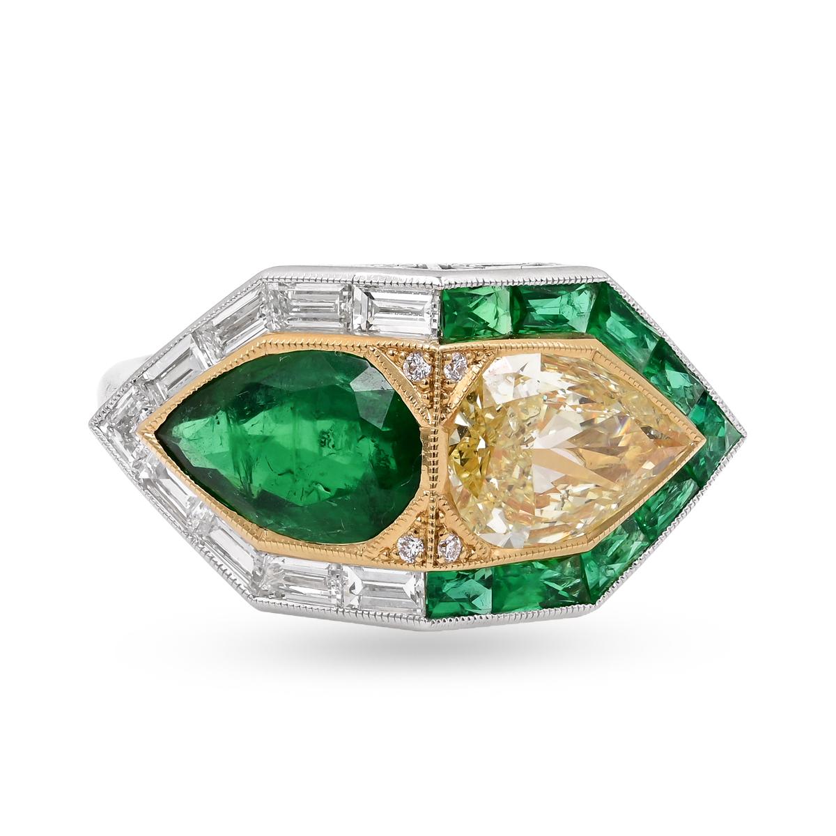 An art deco style ring by Sophia D featuring a pear shaped emerald and a pear shaped fancy yellow diamond surrounded by baguette cut diamonds and french cut emeralds set in platinum and 18K yellow gold.

Total emerald weight: 1.41 carats
Total fancy