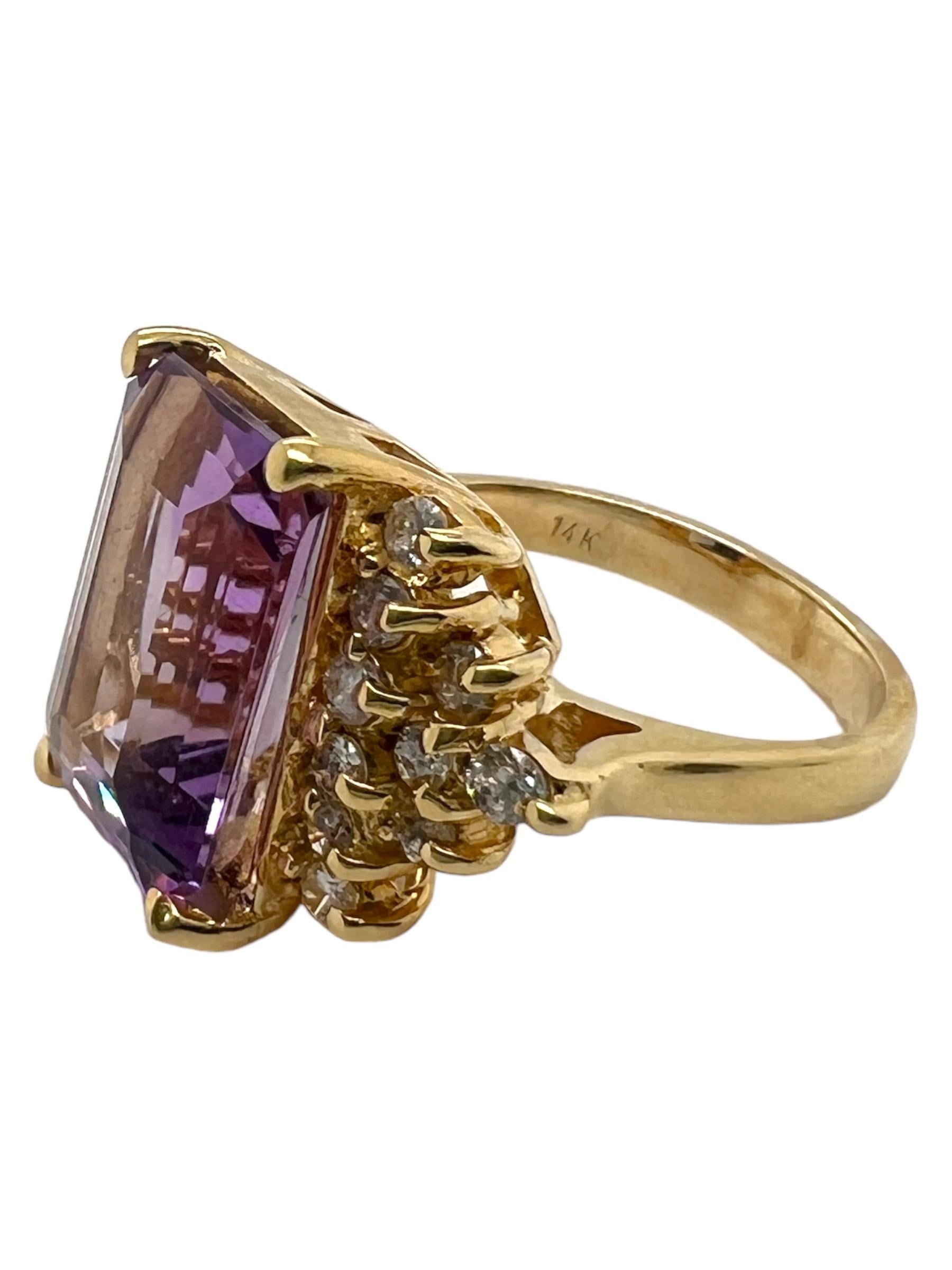 This ring features an emerald cut amethyst center stone accented by clusters of small round diamonds on each side. The band is made of 14K yellow gold, complementing the vibrant color of the main gemstone.

Sophia D has been known world-wide for