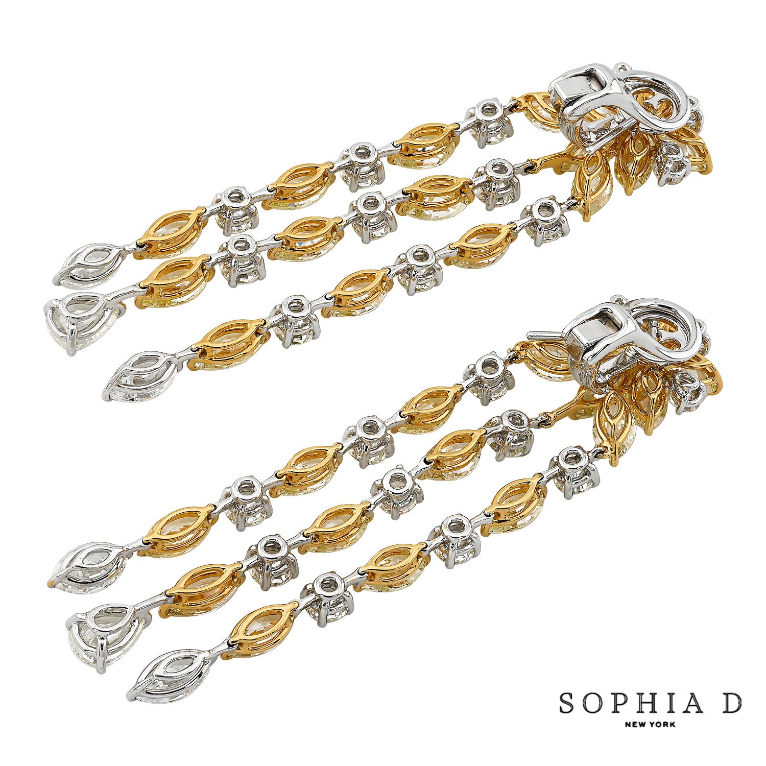 Orecchini in oro giallo 18 carati di Sophia D. Gli orecchini a clip presentano un diamante giallo e un diamante di 22,10 carati. 

La lunghezza totale è di circa 3,0
