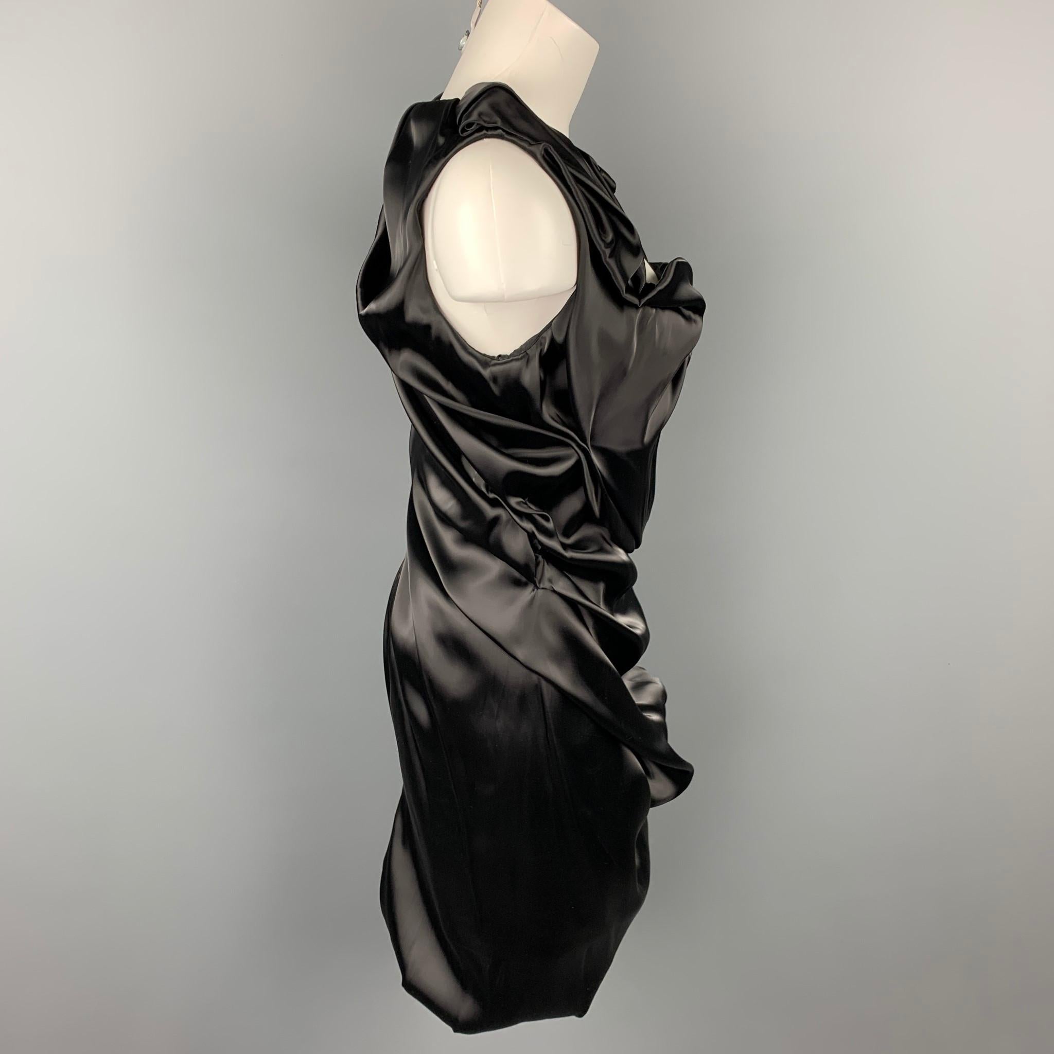 SOPHIA KOKOSALAK cocktail dress comes in a black satin nylon blend featuring  ruched design, snap button shoulder, and a side zip up closure. Made in Italy.

Very Good Pre-Owned Condition.
Marked: IT 42

Measurements:

Bust: 30 in.
Waist: 26