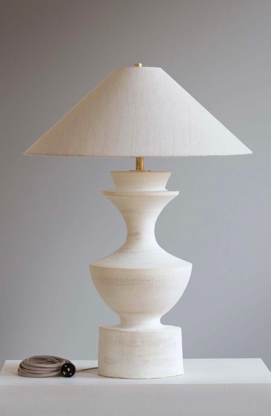 The Sophia lamp is handmade studio pottery by ceramic artist by Danny Kaplan. Shade included. Please note exact dimensions may vary.

Born in New York City and raised in Aix-en-Provence, France, Danny Kaplan’s passion for ceramics was shaped by