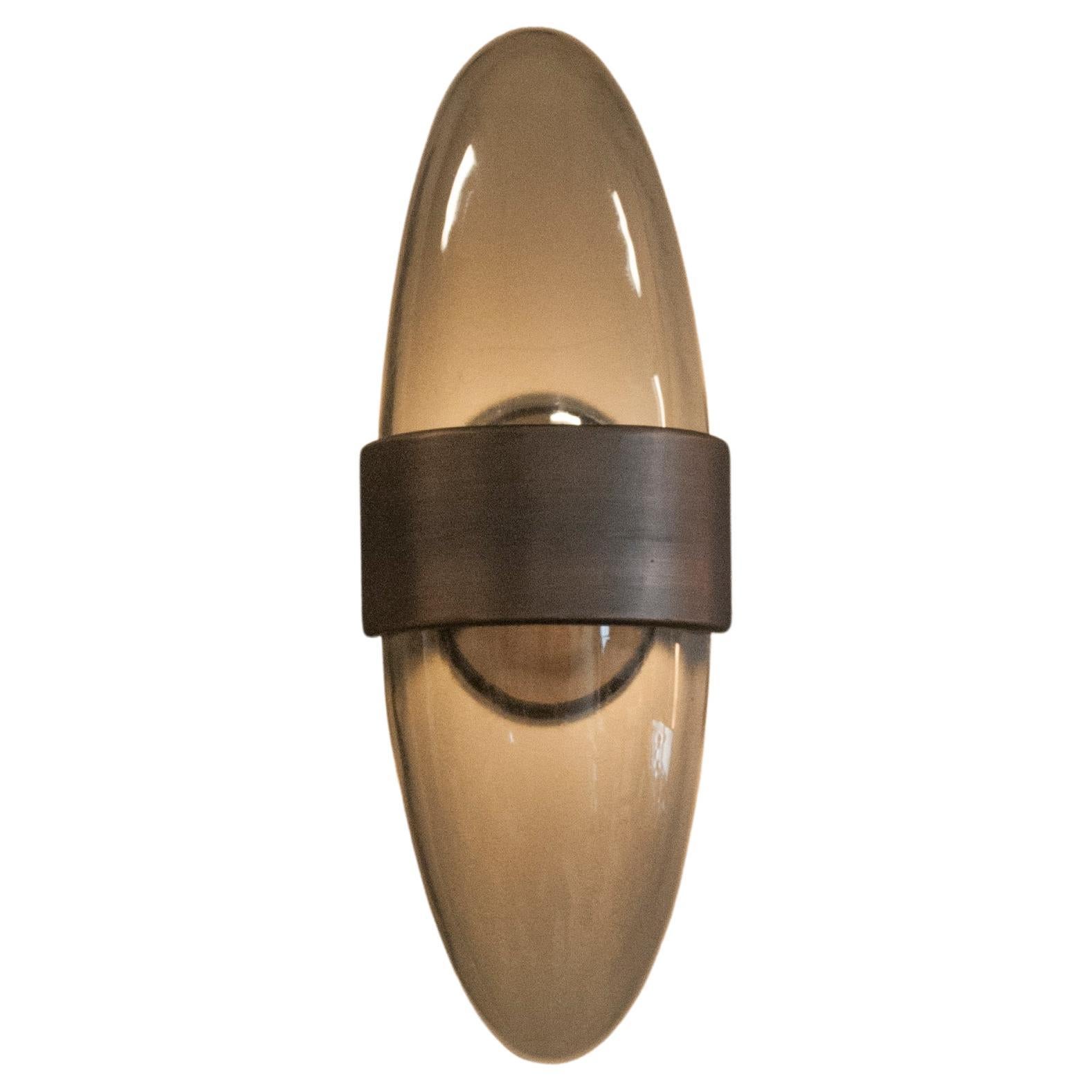 The Sophia sconce is the perfect marriage of Glass and Bronze.
Designed by Sam Hilliard 2017
Cast Bronze / Kiln formed Glass 
Made in Arcata CA, USA
UL listed.
 
