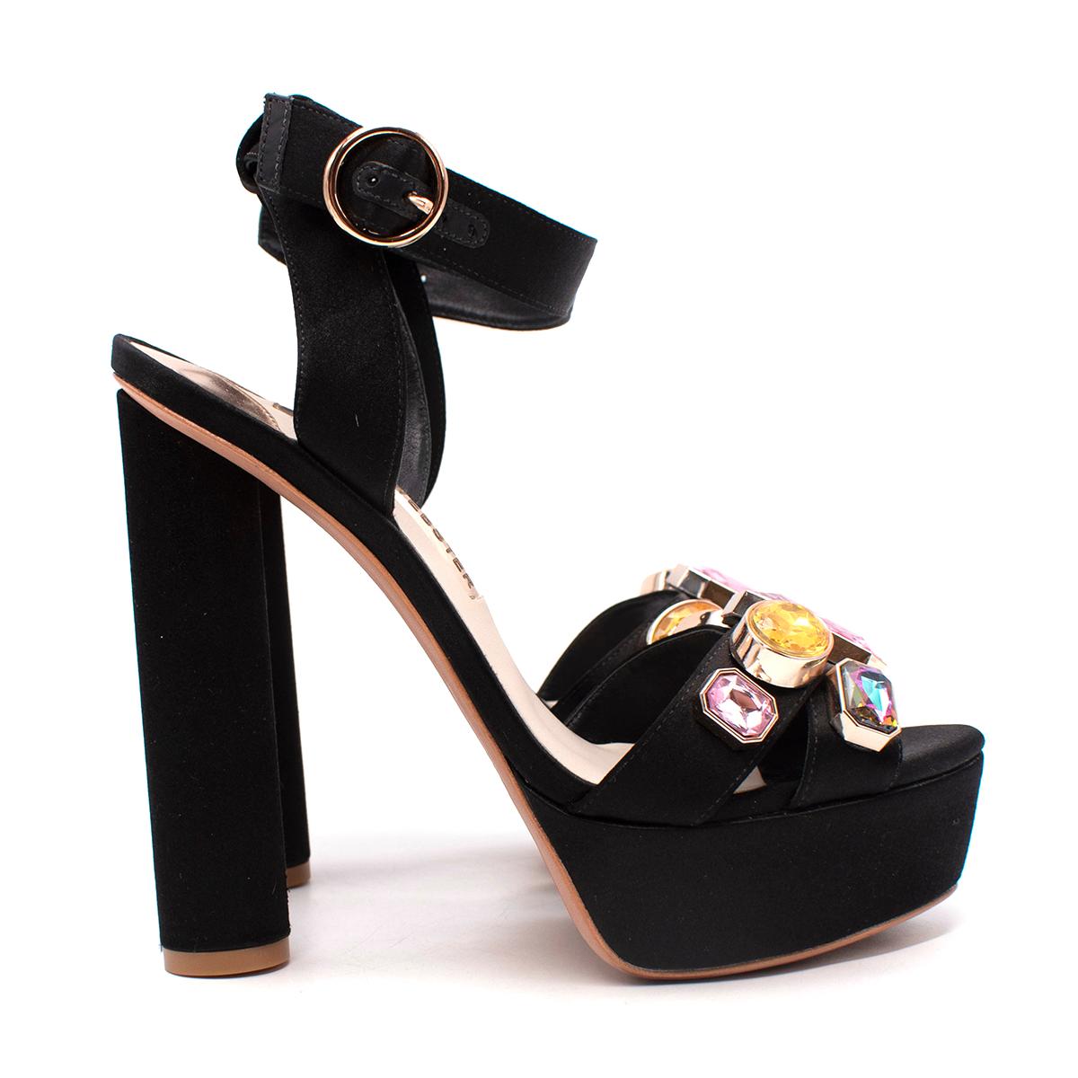 Sophia Webster Amanda Gem Black Satin Heeled Sandals

- Black satin upper with two straps to the rounded toe
- Embellished in multicolour crystals in pink and yellow tones
- Adjustable ankle strap
- Set on a high rounded heel and a
