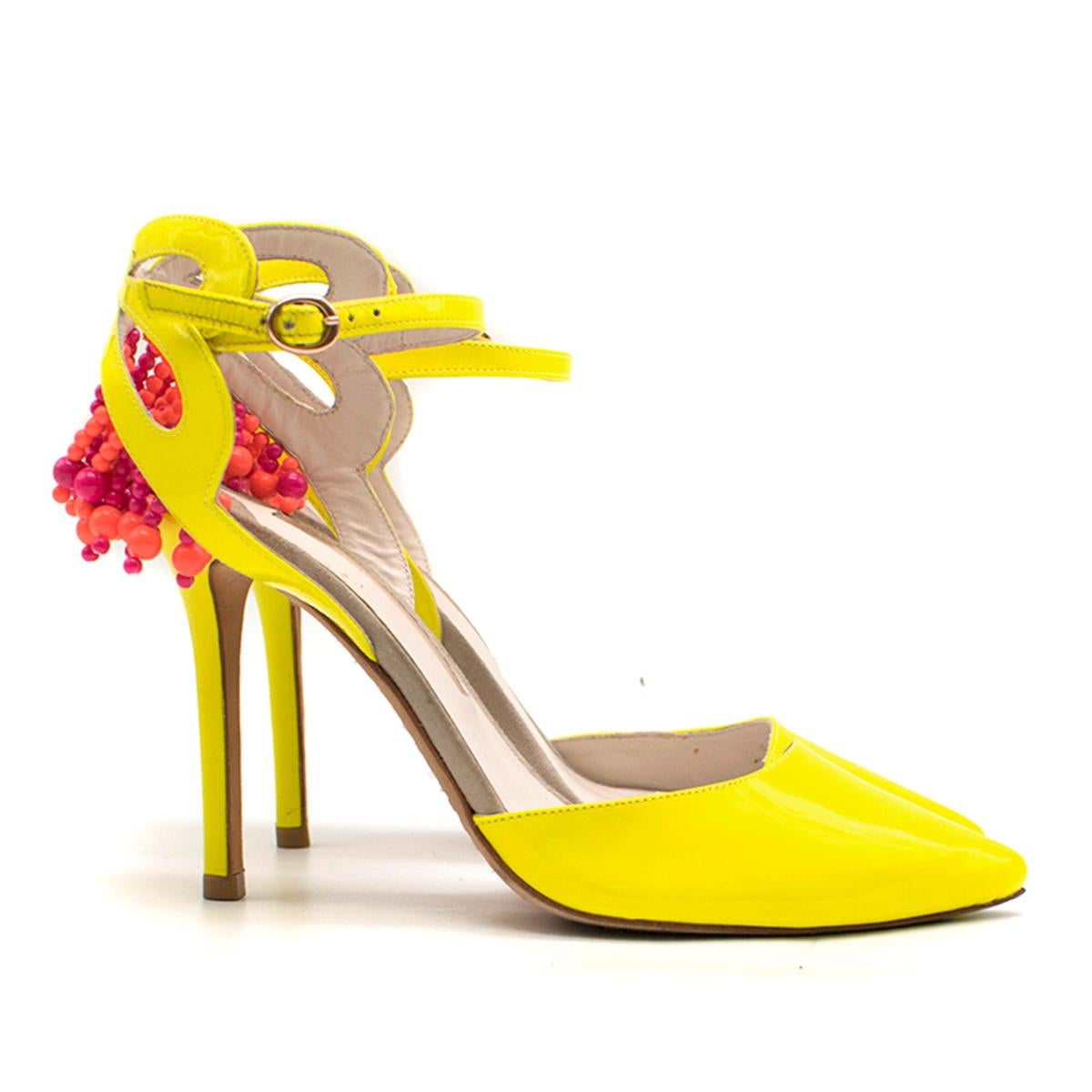 Sophia Webster Amina Patent Leather Beaded Pumps

- Bright yellow leather patent pumps
- Stiletto heel
- Leather cut-out to the inner sides
- Pointy toe
- Ankle buckle strap 
- Heel cutouts with beaded embellishment

Please note, these items are