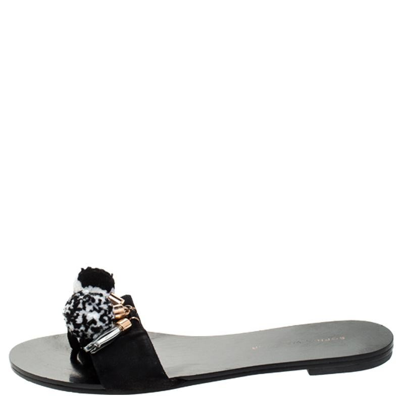 For days of ease and style, Sophia Webster created these flat slides. They have suede uppers embroidered with pompoms and the insoles are lined with leather for comfort. The slides will come in handy with many of your outfits.

