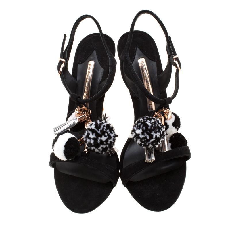 Flaunt style at its best with these beautiful Layla suede sandals. Accentuated with gold-tone hardware, these T-strap sandals are embellished with pom pom detail. This black creation features 11.5 cm pencil heel. Team your favourite outfit with this