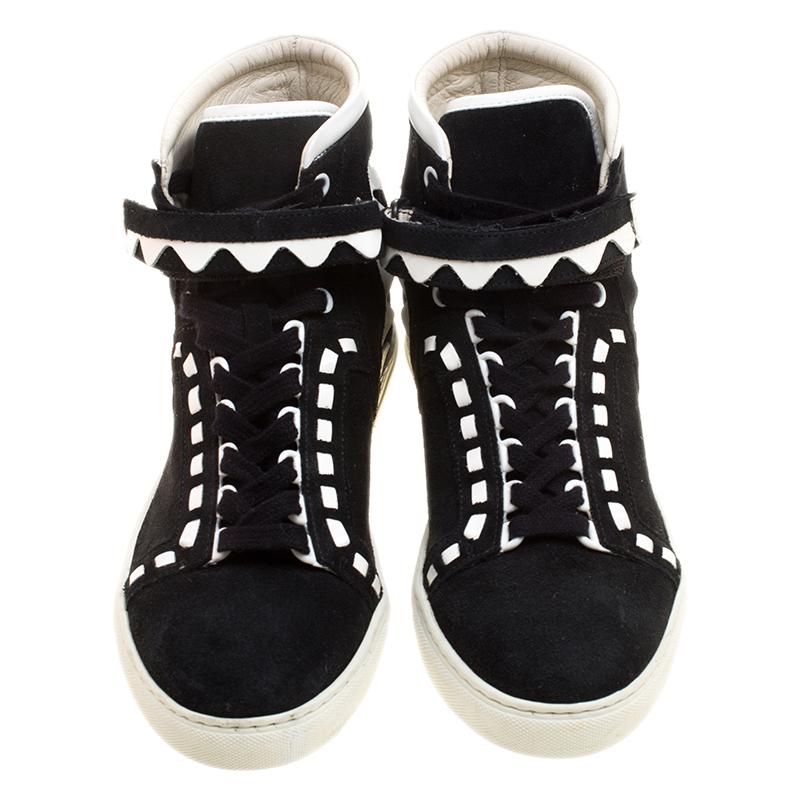 Keep your look edgy and cool with these Sophia Webster Riko sneakers. Designed in a high-top silhouette, this pair features a monochrome suede and leather body and rounded off with lace-ups. They are set on a thick rubber sole that not only add to