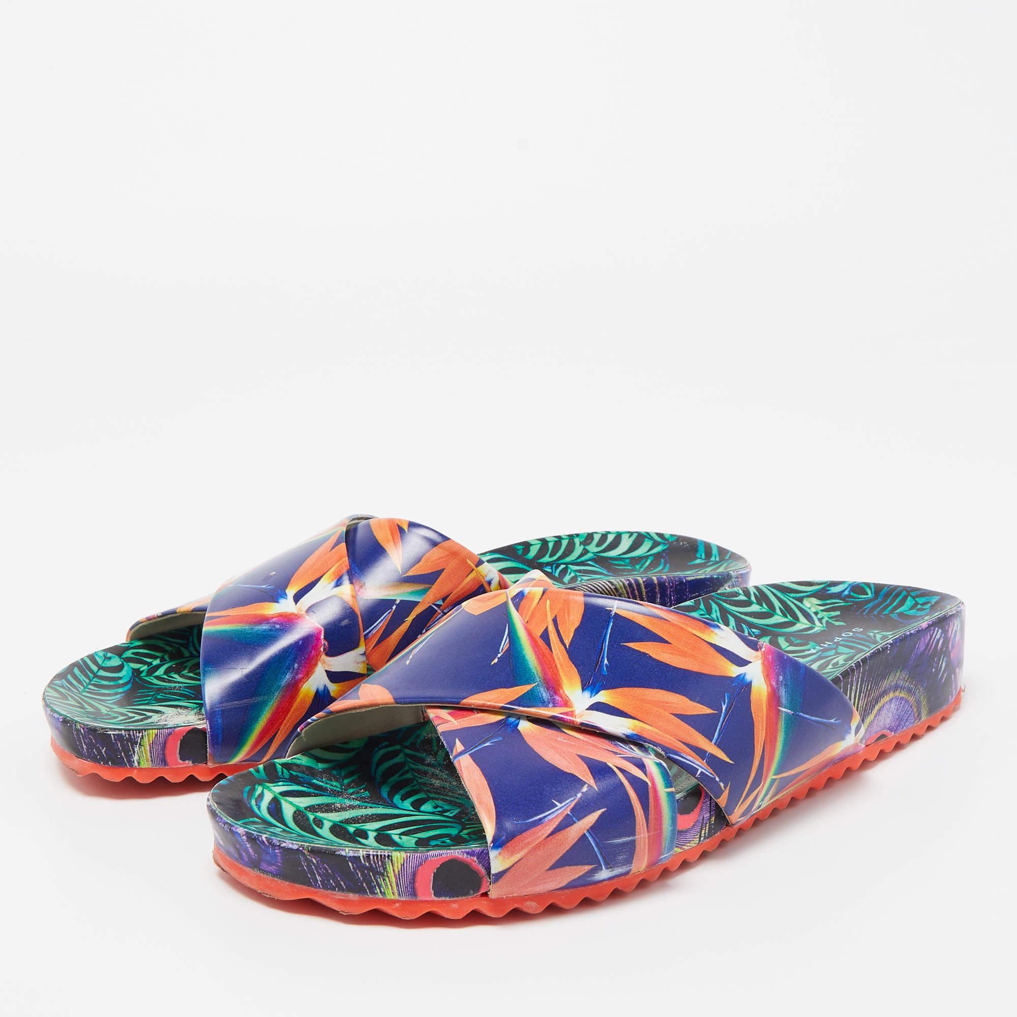 Sophia Websters slides for women have colorful prints all over the exterior. Theyre perfect for the beach vacation days or everyday use.