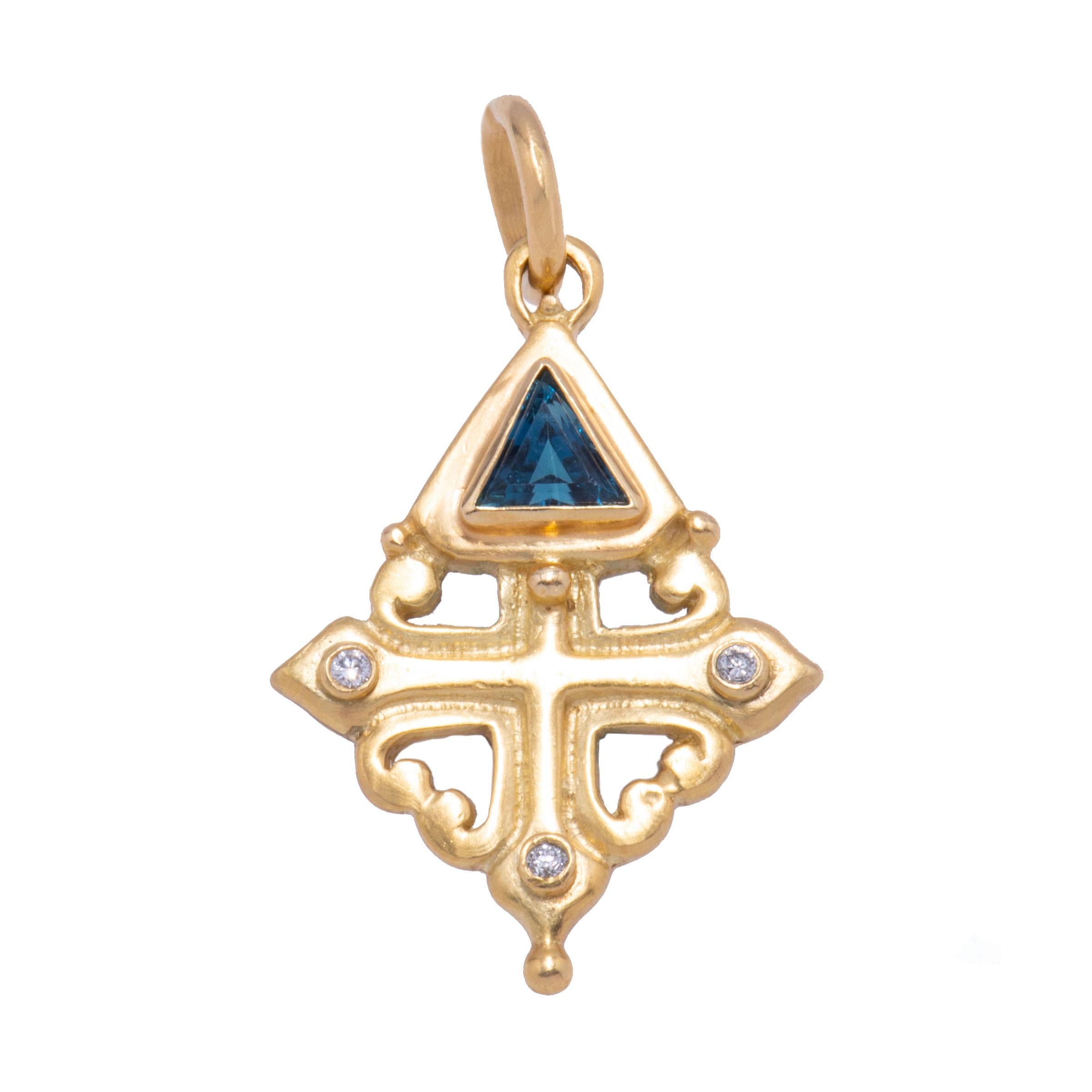Sophia's Cross Pendant in 18 karat gold takes a cue from Medieval and Byzantine designs. The inner cross is topped with diamonds and a magnificent teal blue/green tourmaline is a bezel set triangle. Knights of the Templar? A great queen of yore? A
