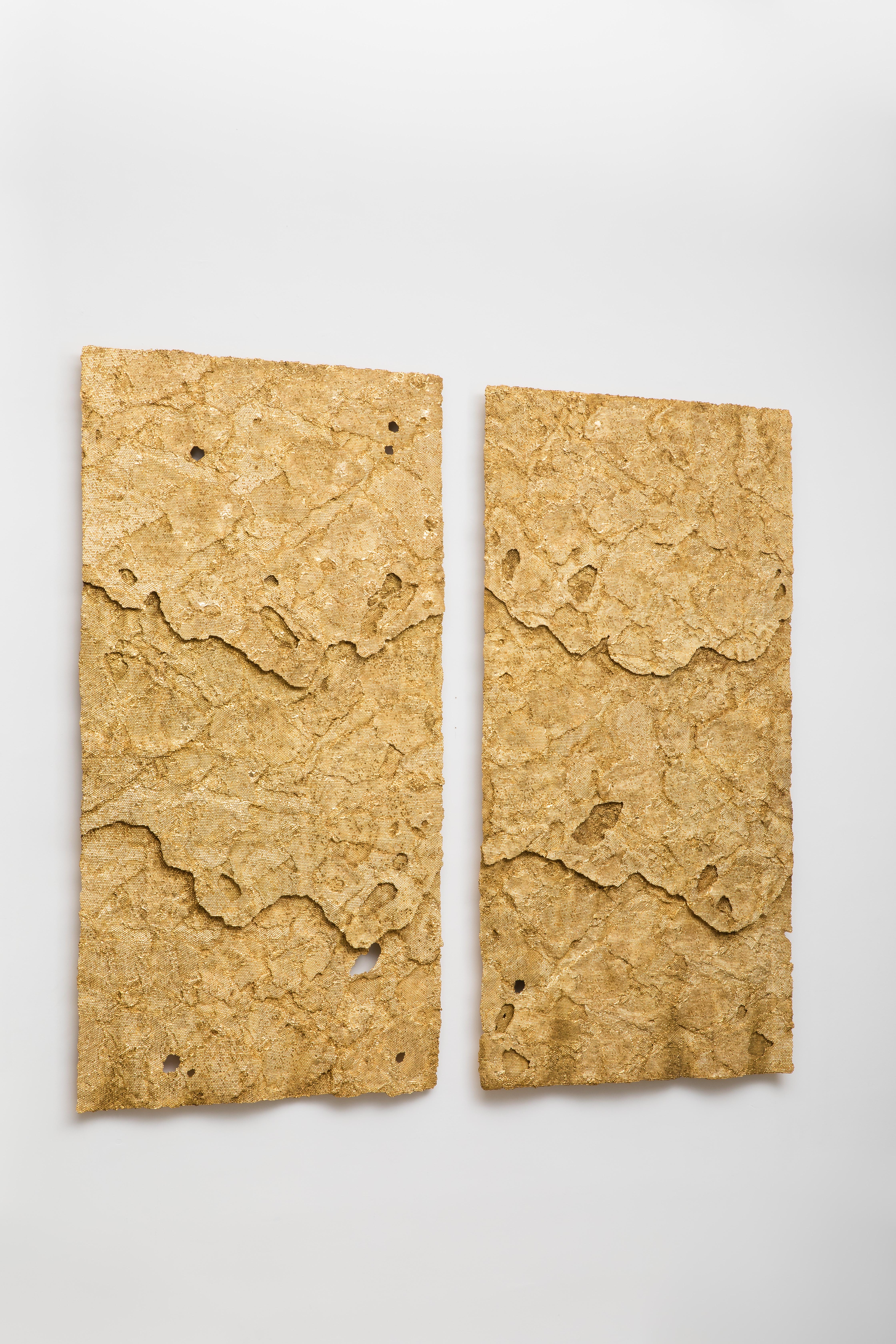 Dossel Diptych, a large-scale wall hanging, is composed of two panels of layered honeycomb cast in Jesmonite, which have been embellished with cold enamel resin to simulate honey and then gilded and highly patinated.  The overlapping layers of the