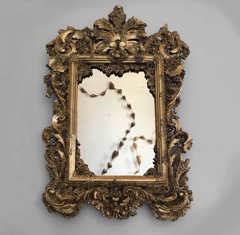 Sophie Coryndon’s Honeycomb Marriage Mirror takes inspiration from grotto furniture. From the 16th century onward, grottoes were constructed as fanciful retreats from reality. Throughout Europe, these fantasy structures were “adorned with
