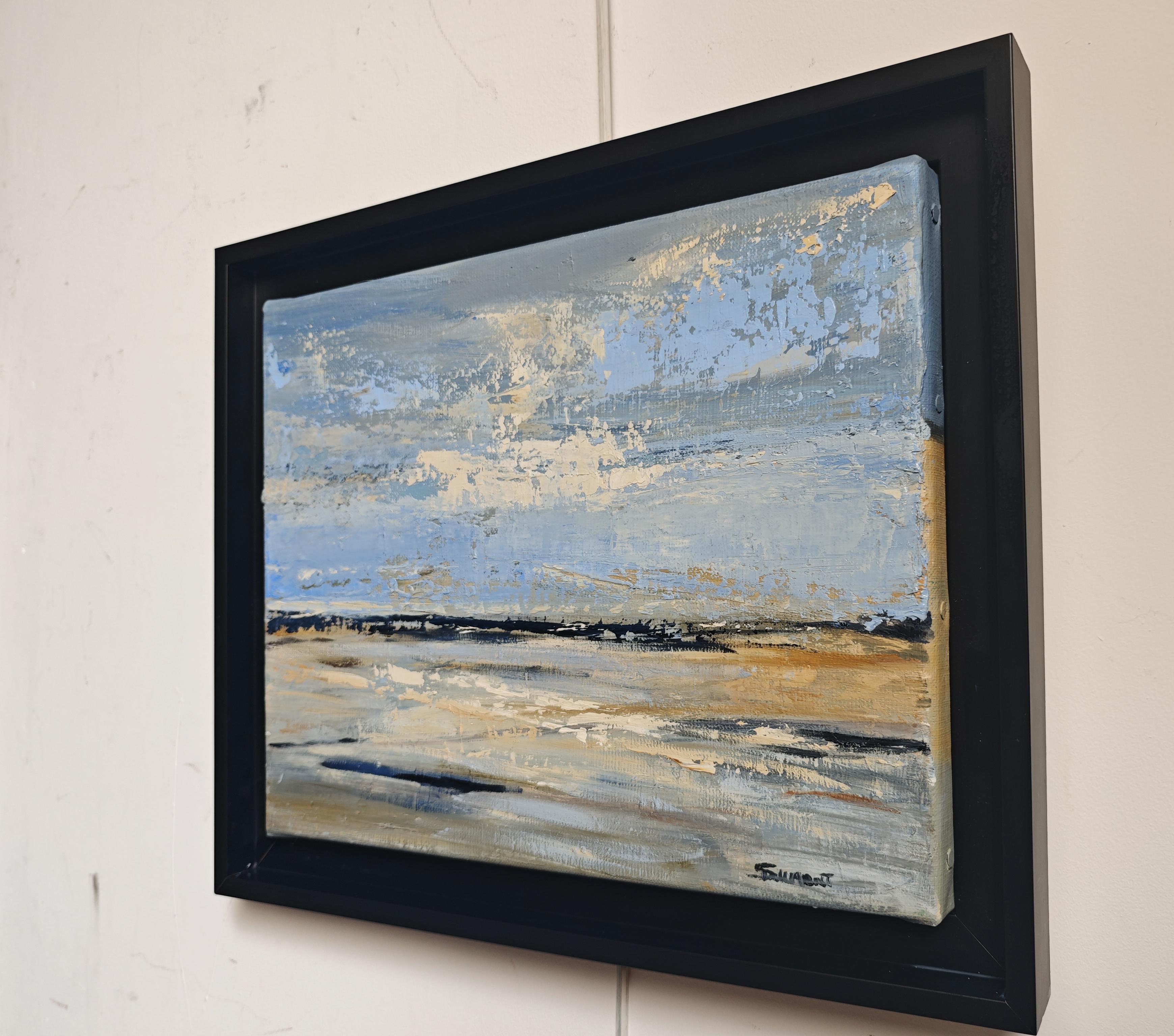 French contemporary artist Sophie Dumont captures the serene beauty of the Normandy coast in this original oil on linen painting. Executed with a palette knife, the composition reveals textured layers of soft blues, sandy beiges, and warm ochres,