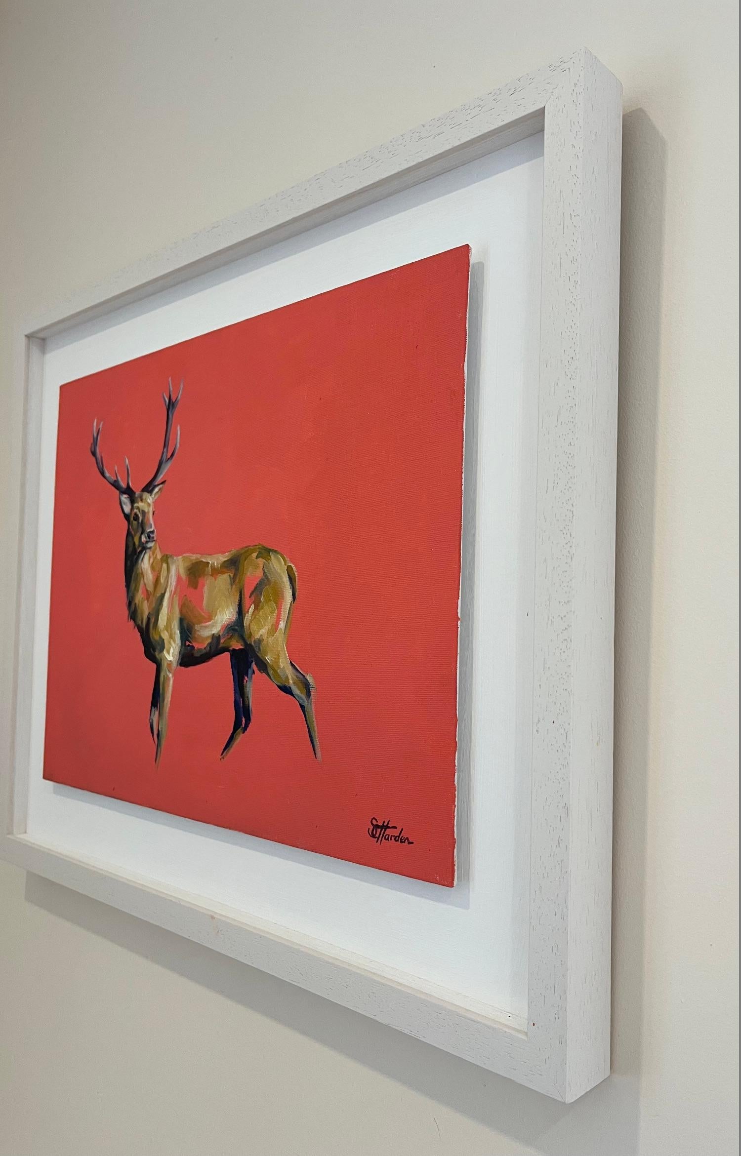 Hart of mine is an original oil painting by Sophie Harden. Contrasted blues and fawns on a coral background gives this piece a huge pop of colour and sense of movement the stag stands proud looking out to the room. Framed on a floating mount within