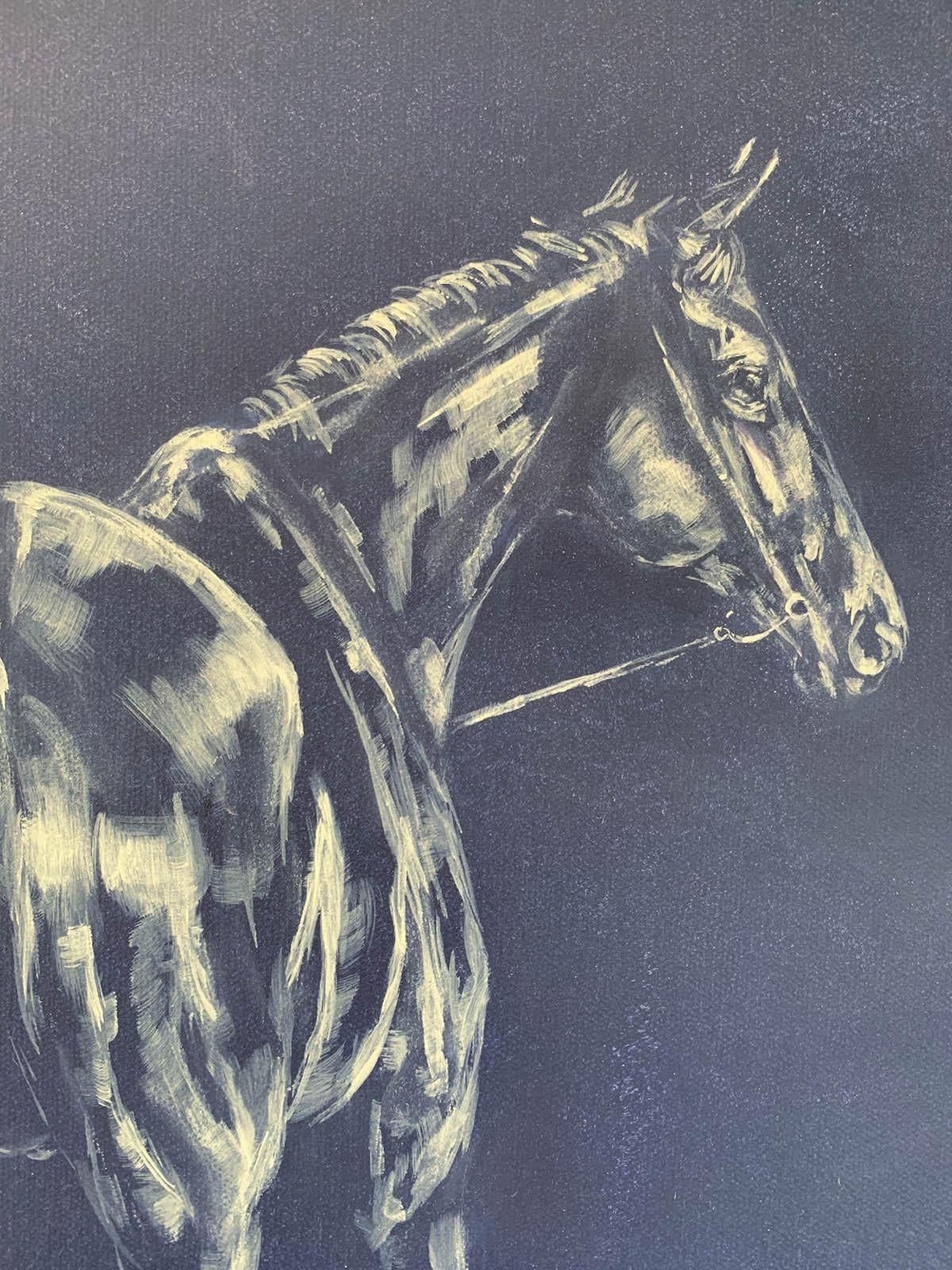 Original oil painting by Sophie Harden. Next Lot is an atmospheric filled piece of a horse being led to be saddled up for the next lot on the gallops. Set on a vivid dark blue background, using white oil to pick out where the light hits the subject