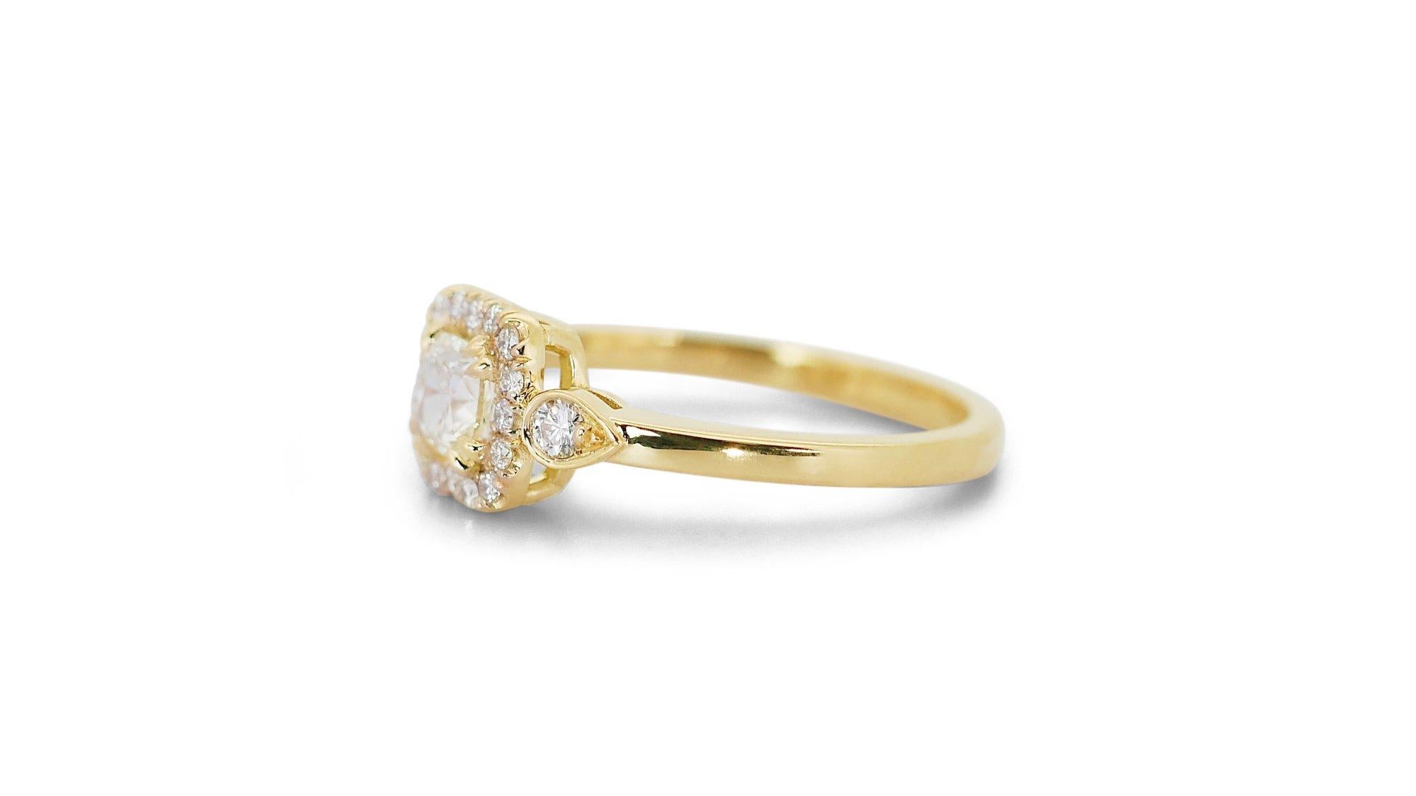 Sophisticated 0.96ct Diamonds Halo Ring in 18k Yellow Gold - GIA Certified

This elegant 18k yellow gold halo ring showcases a breathtaking 0.71-carat cushion-shaped diamond as its centerpiece. The main diamond is beautifully surrounded by 18 round