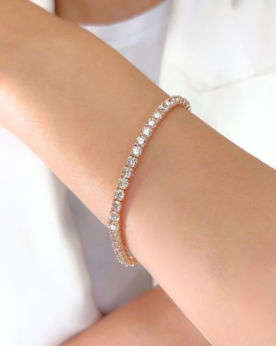 Sophisticated 10.03ct Diamonds Tennis Bracelet in 14k Rose Gold - IGI Certified

This remarkable tennis bracelet features 45 round brilliant diamonds totaling an impressive 10.03 carats. Set in romantic 14k rose gold, each diamond dazzles with