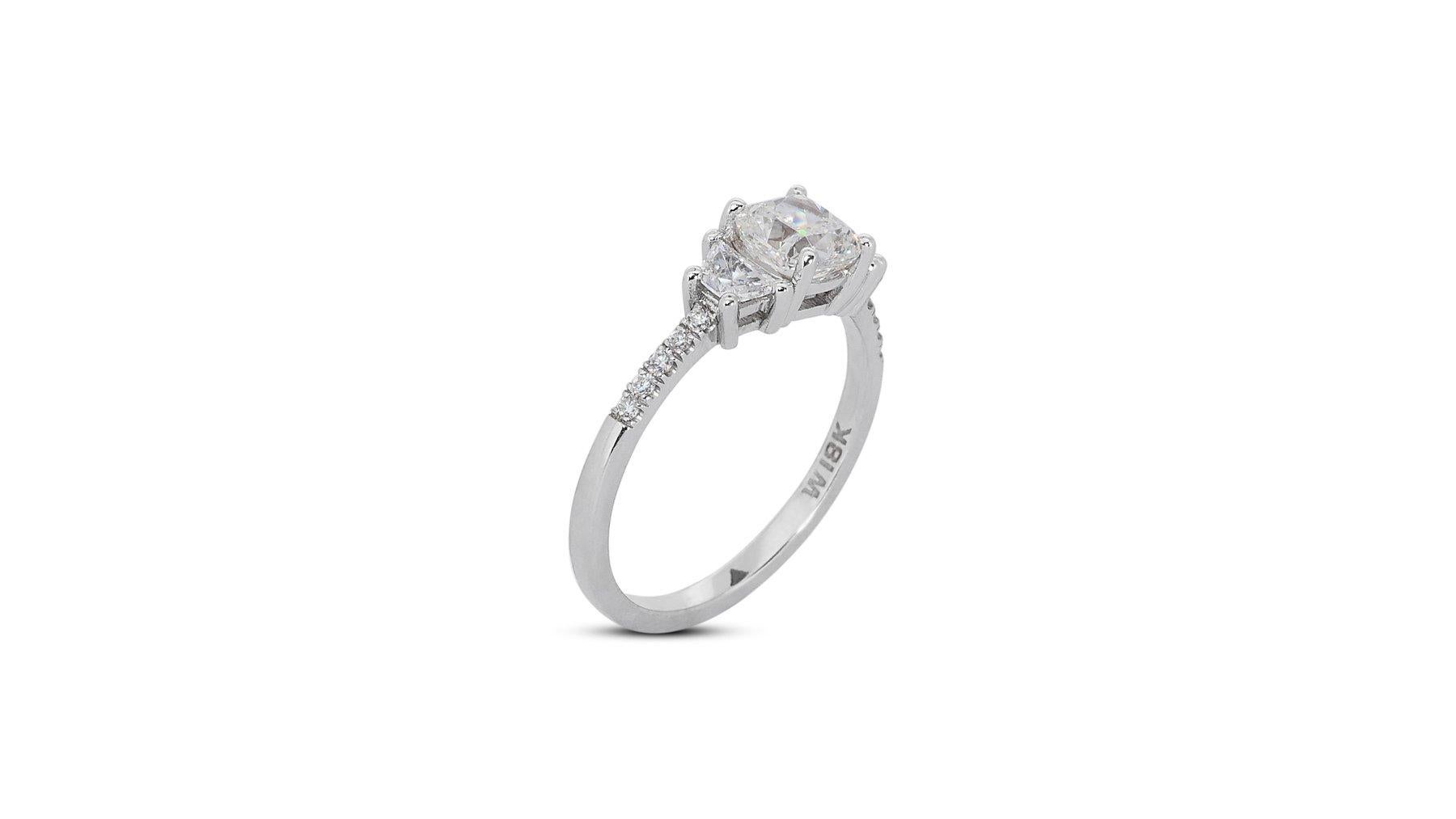 Sophisticated 1.80ct Diamonds 3-Stone Ring in 18k White Gold - GIA Certified

Experience the epitome of elegance with this luxurious diamond ring, crafted in 18k white gold and featuring a magnificent 1.29-carat cushion-cut diamond. Enhancing the