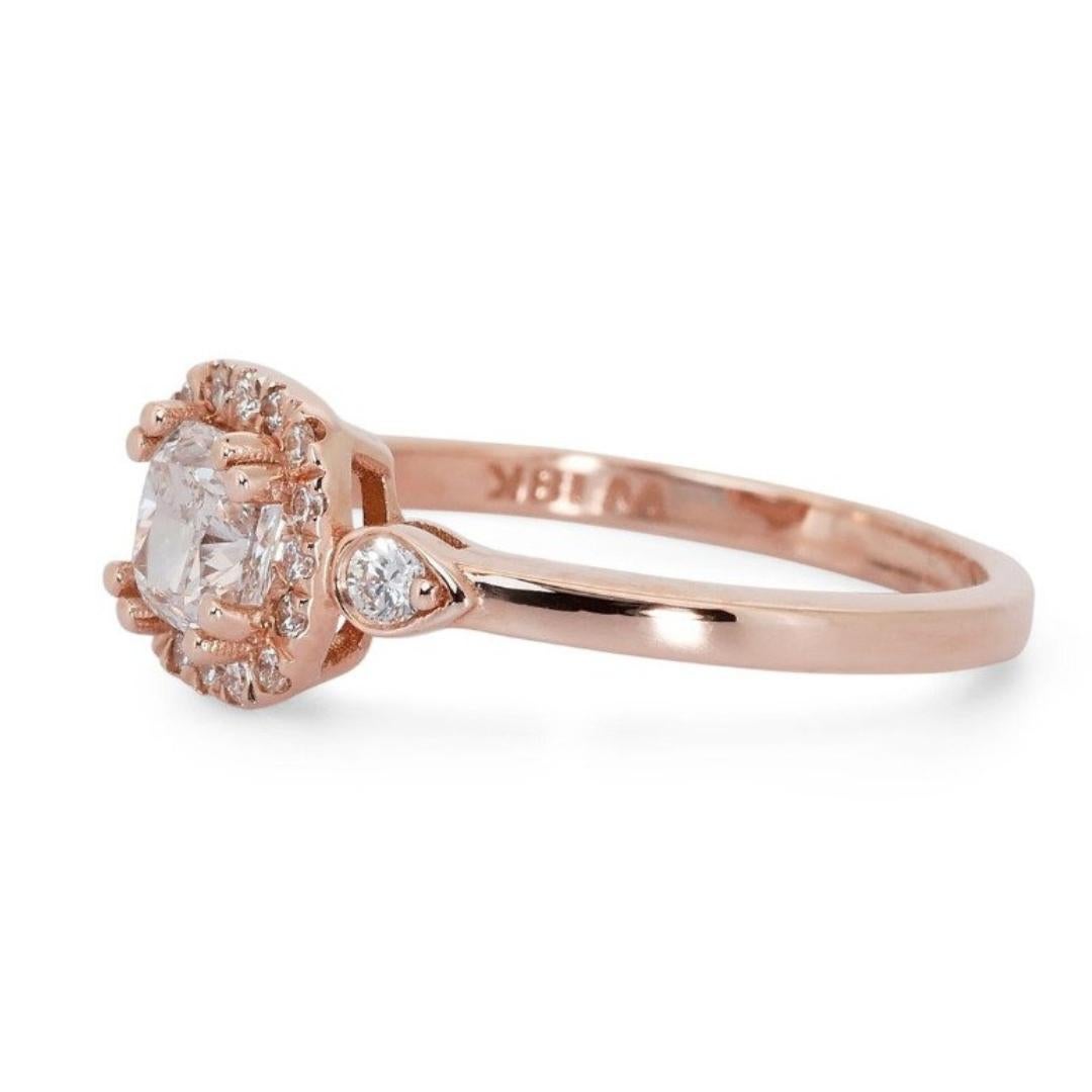 The centerpiece of this exquisite ring is a 1.03-carat Cushion-cut diamond, radiating with brilliance and sophistication. Graced with a Color Grade of H and an exceptional Clarity Grade of VVS2, this main stone epitomizes understated luxury. The GIA