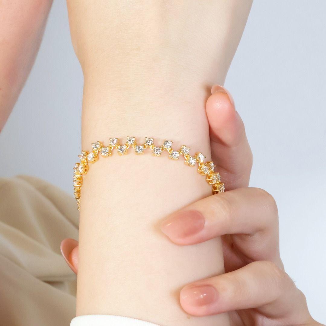 Unveiling a luxurious 18k yellow gold bracelet, meticulously crafted to showcase 54 sparkling round brilliant diamonds. These captivating stones boast an impressive total carat weight of 4.32 carats, boasting a near-colorless G color grade for