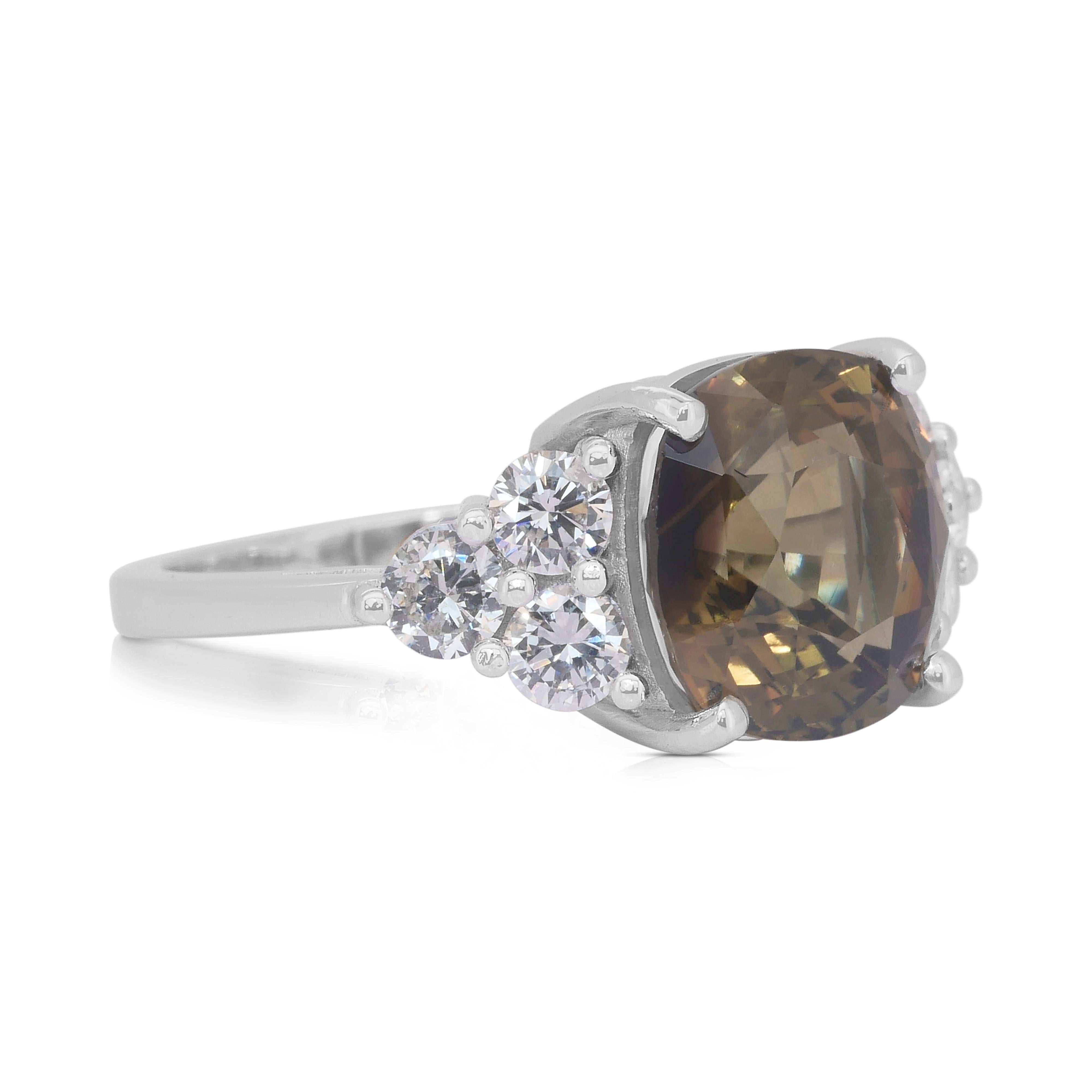 Sophisticated 7.14ct Chrysoberyl and Diamonds in 14k White Gold - GIA Certified

Showcasing a stunning 6.16-carat cushion-cut chrysoberyl with a captivating brownish-green-yellow hue, this 14k white gold ring is a masterpiece of nature's beauty.