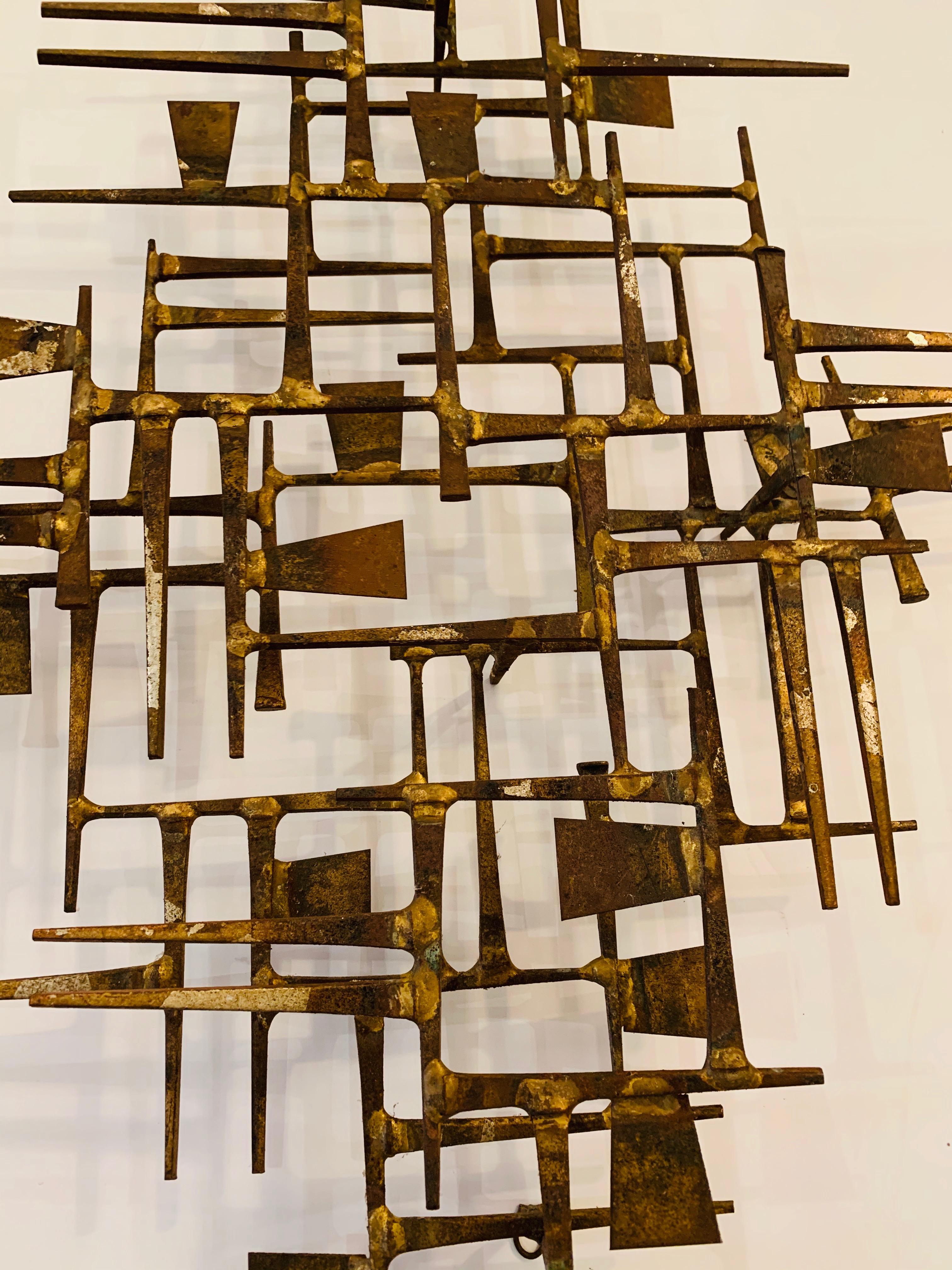 A one of a kind sophisticated hand forged Mid-Century Modern brass wall sculpture having geometric overlapping lines and rectangles.
Can be hung vertically or horizontally.