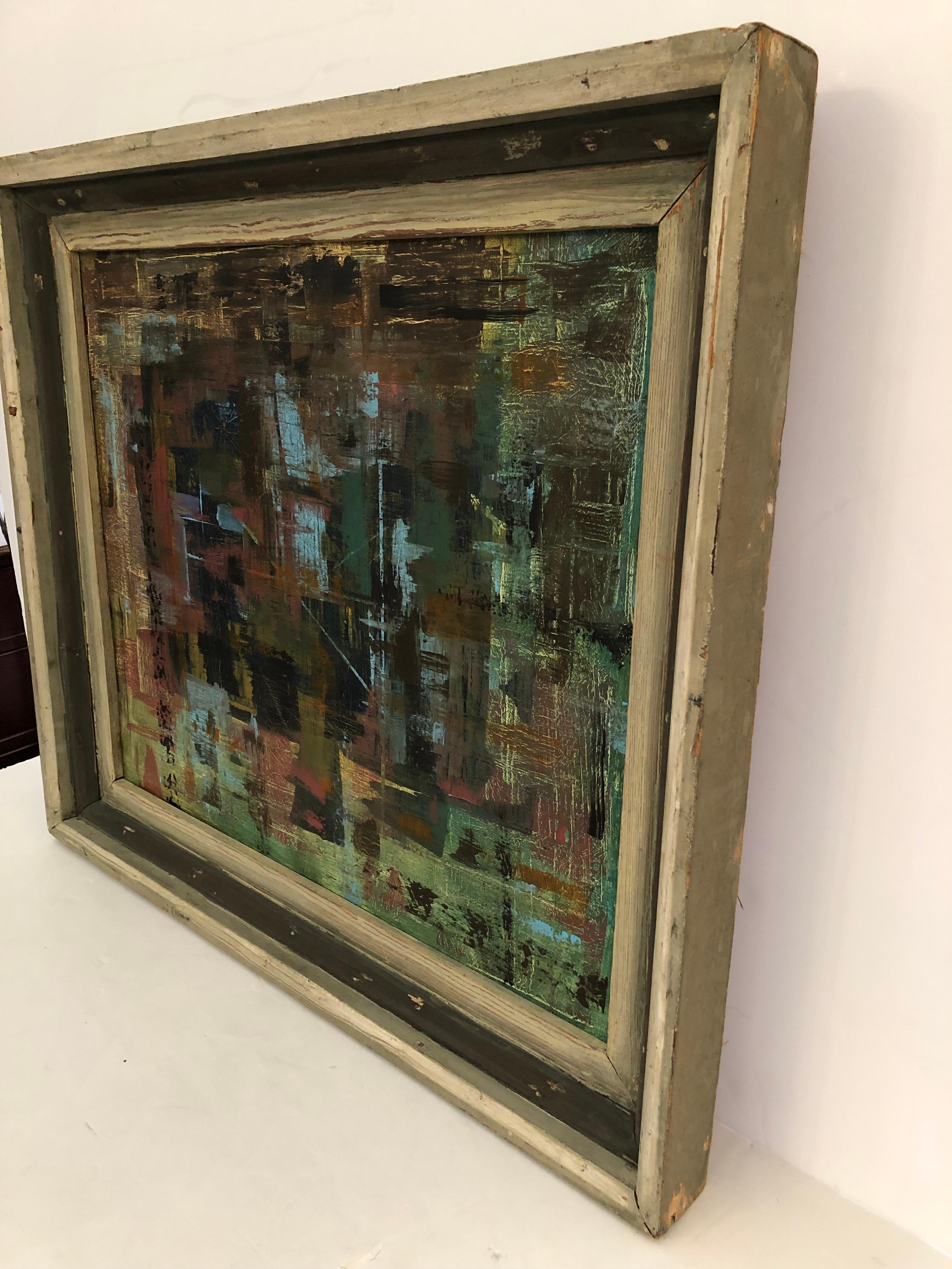 Beautifully rendered abstract painting having textural layered surface and rich color palette of navy, green, burnt orange and turquoise. Signed on the back but illlegible. Wonderful vintage painted wooden frame with a rugged rustic feel.
Canvas