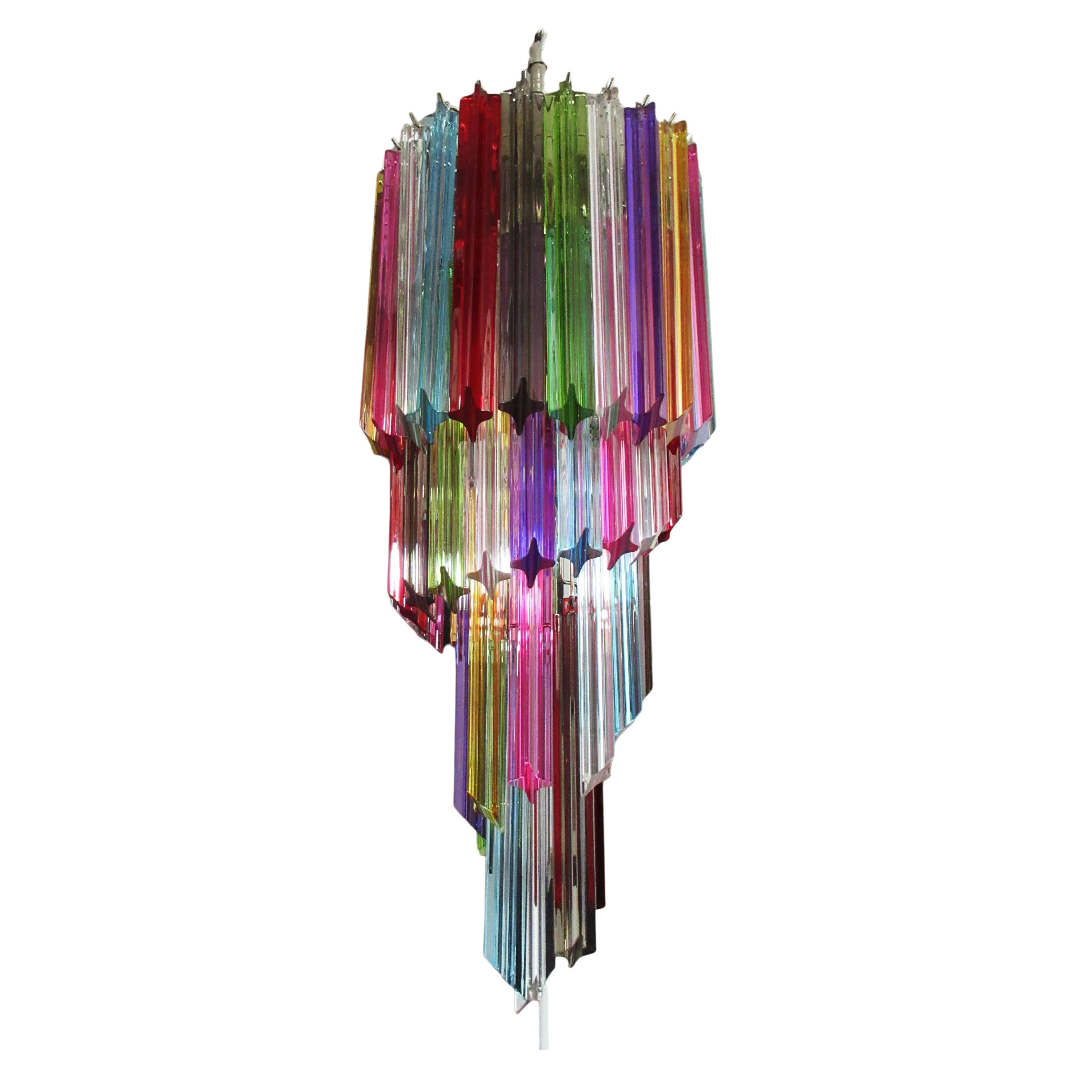 Fantastic vintage Murano chandelier made by 54 Murano crystal multicolored prism in a nickel metal frame.The shape of this chandelier is spiral.
Period:late XX century
Dimensions: 61 inches height (155 cm) with chain; 33,50 inches height (85 cm)