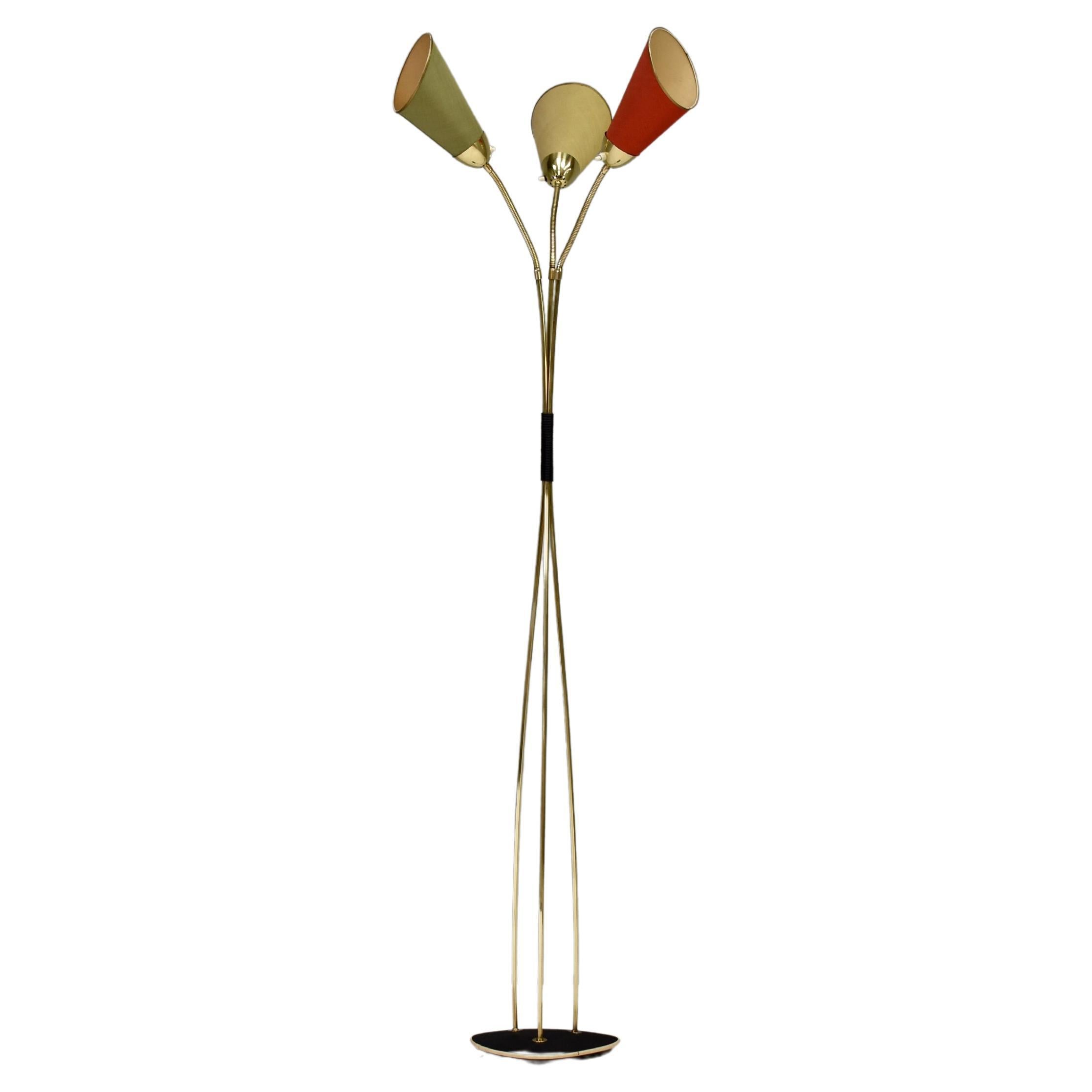 Elegant 1950’s Italian floor lamp in brass and three fabric shades in pastel colours. The shades can be bent in all ways. The heritage can't be determined exactly but the manor of craftsmanship, design and quality show high-end and sophisticated