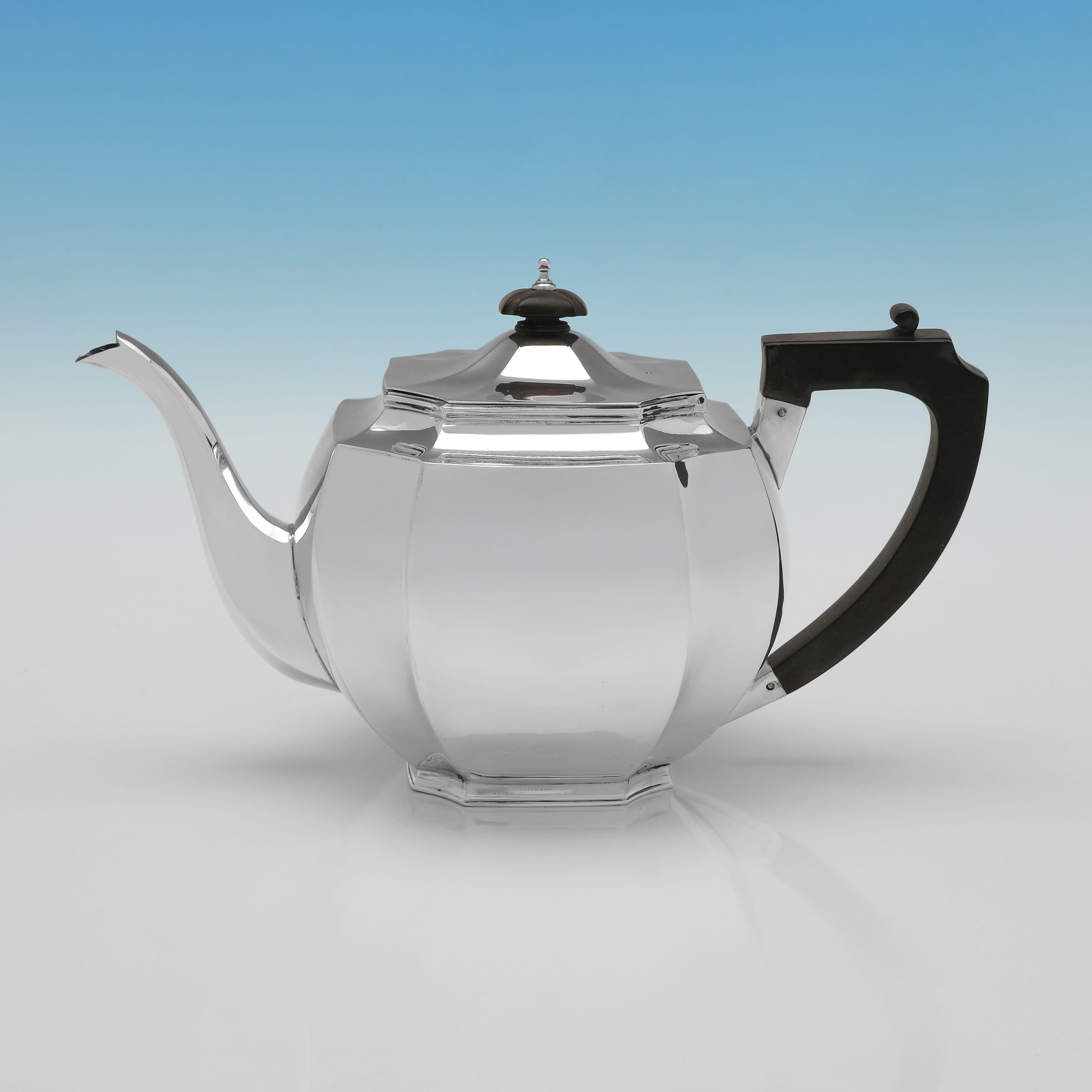 Hallmarked in London in 1930 by C. S. Harris 
Sons Ltd. this sleek George V sterling silver four-piece tea set is of a fine Art Deco design. The pieces have a polished surface and an octagonal panelled form. The teapot and coffee pot are fitted