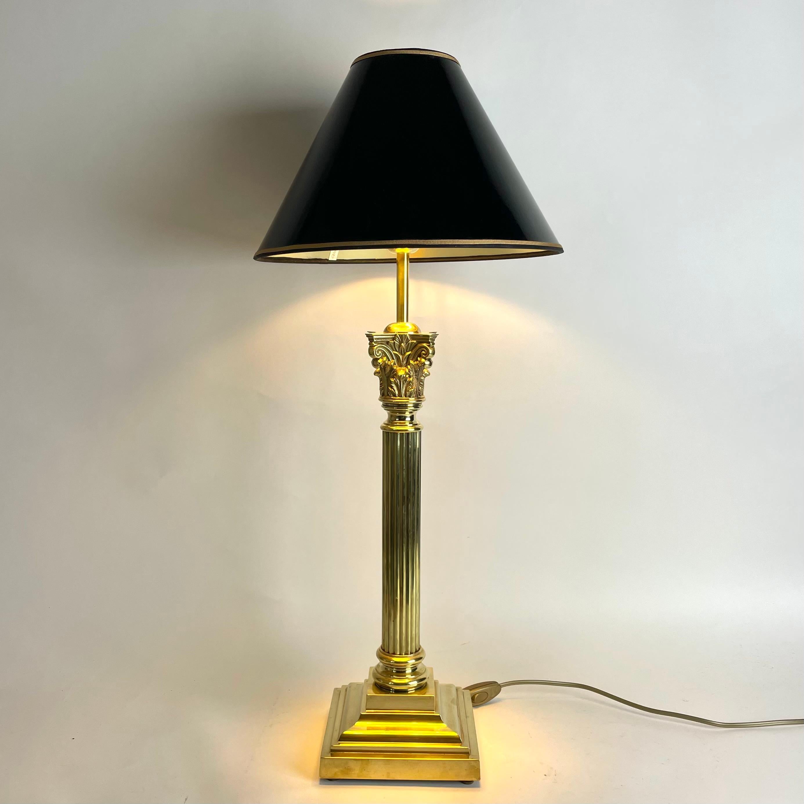 Sophisticated Brass Table Lamp with Classic column made during the late 19th Century. Originally a kerosene lamp converted to table lamp in the early 20th Century.

Newly rewired electricity 

The lampshade in black lacquer with a gilded inside to