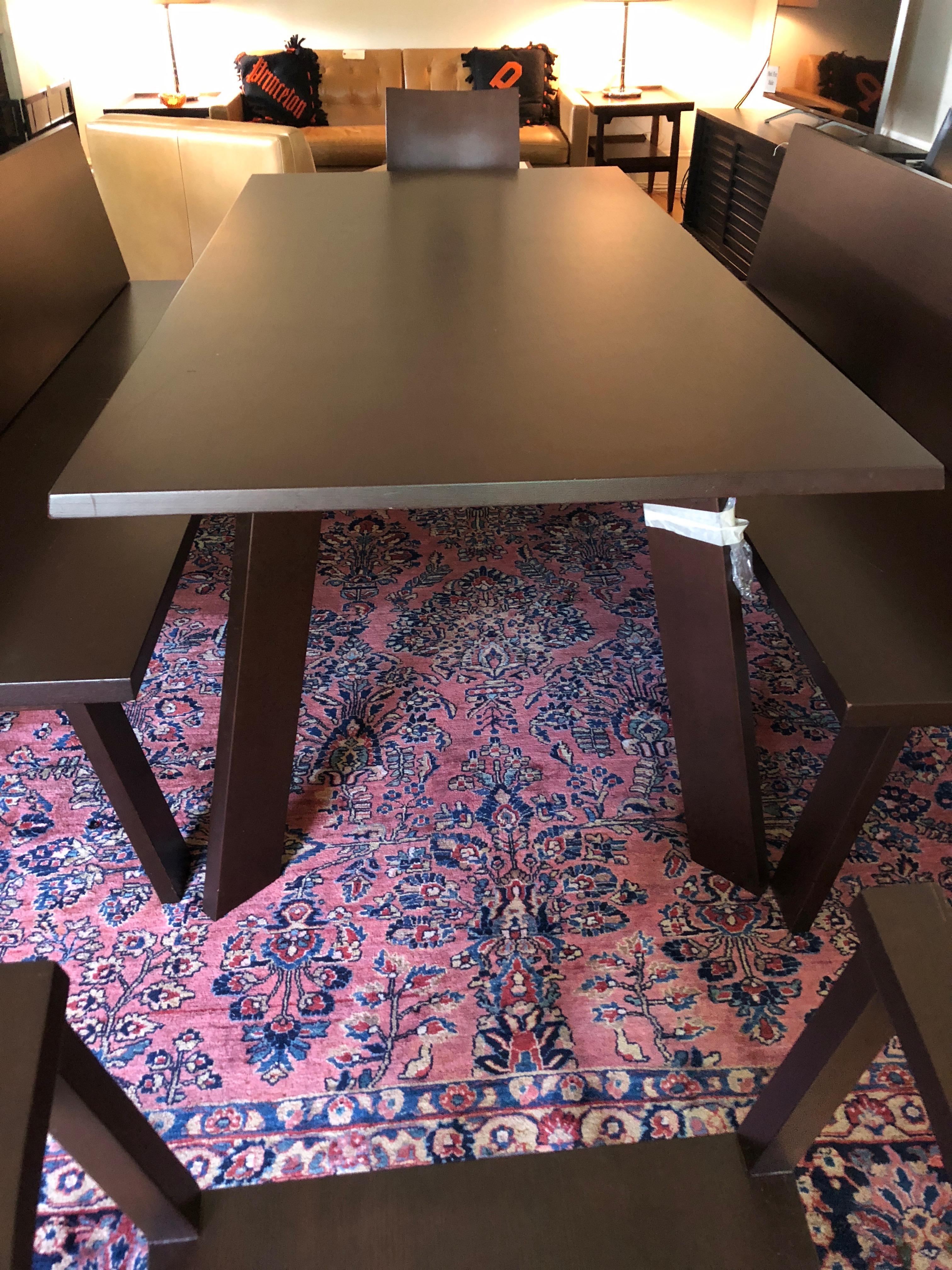 Very modern sleek custom dining table by the German Bulthaup Co., having two matching benches with backs that seat multiple diners along the length of the table. There are also two coordinating armchairs for either end.

Benches measure: 79 L,