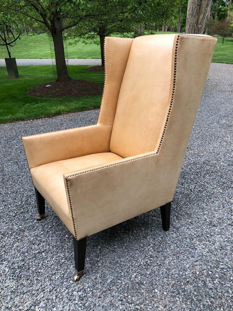 Sophisticated Camel Leather and Brass Nailhead Wingback Chair at