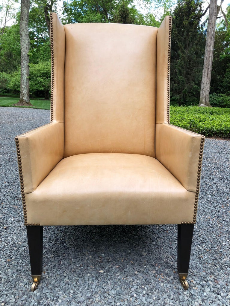 Sophisticated Camel Leather and Brass Nailhead Wingback Chair at
