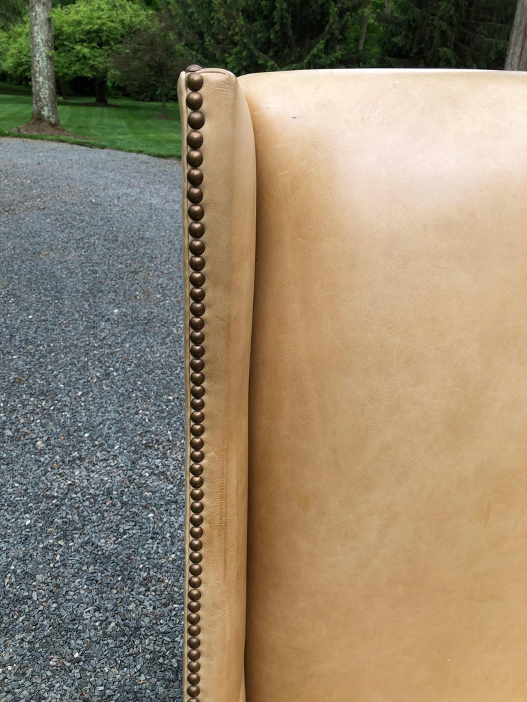 Sophisticated Camel Leather and Brass Nailhead Wingback Chair at