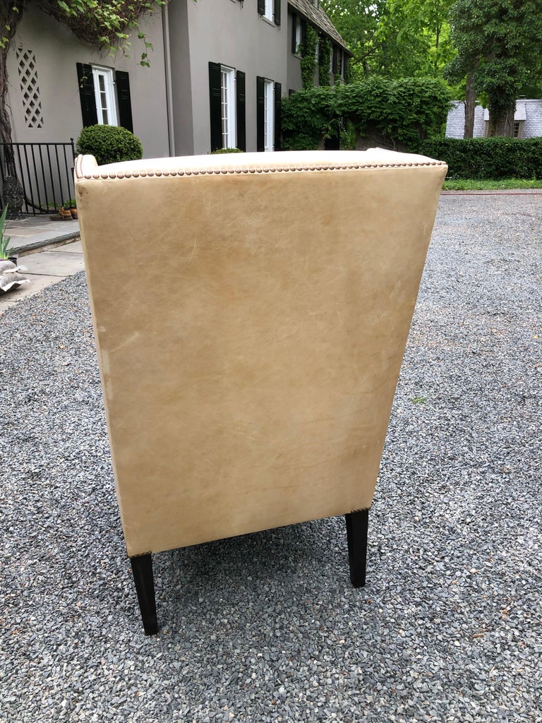 Sophisticated Camel Leather and Brass Nailhead Wingback Chair at