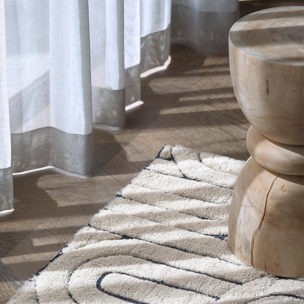 The reality weave features curved organic shapes mixed with clean contrasting lines. This bold and modern style is the perfect hero piece for any space. This soft, sophisticated and luxurious weave is the ideal neutral base with pop of