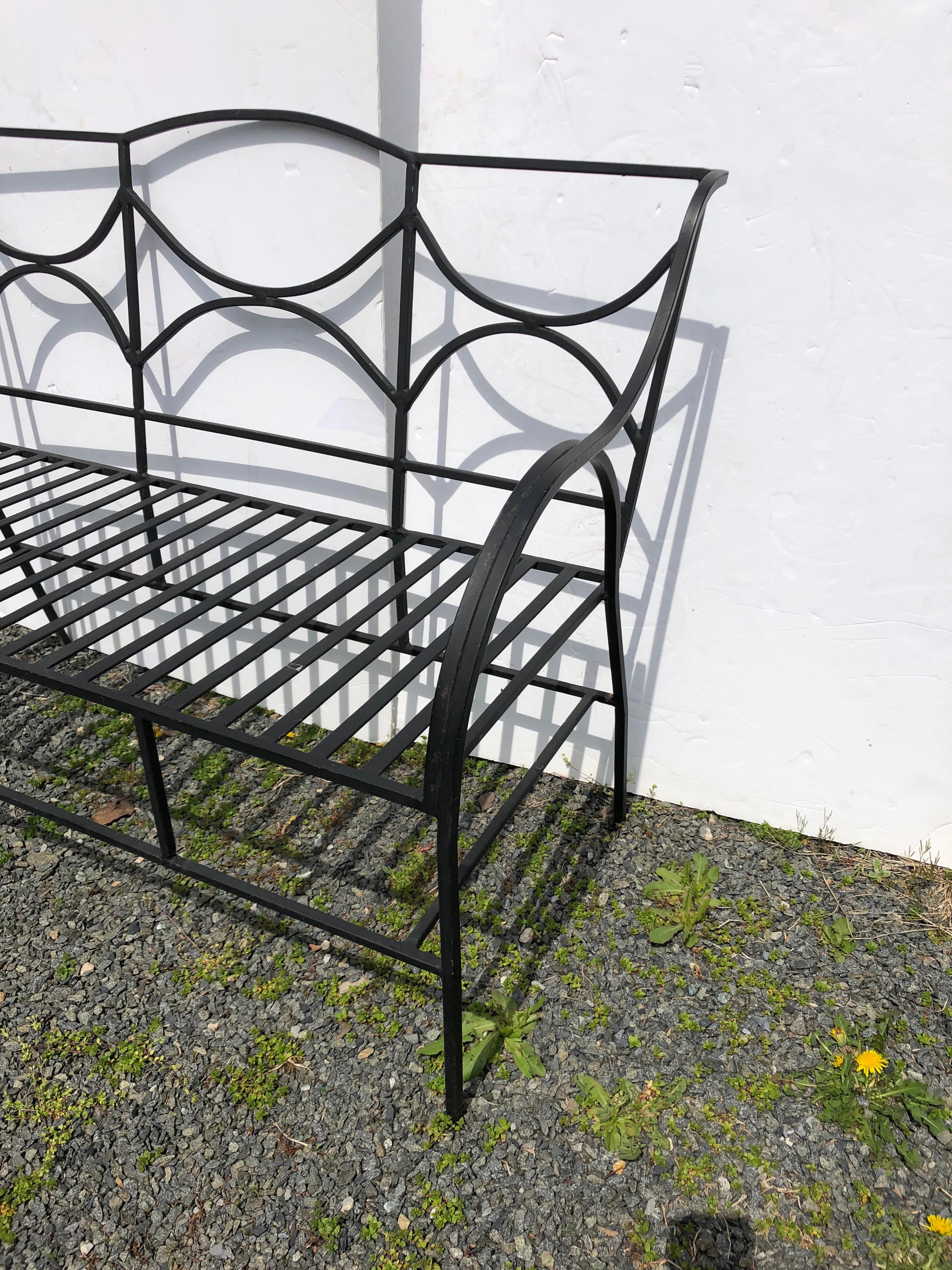 A beautiful sleek but very sturdy well made satin black wrought iron loveseat or bench for the garden or patio, having clean Directorie or Neoclassical lines. No cushion included.
Measures: Seat depth 19
Arm height 25.