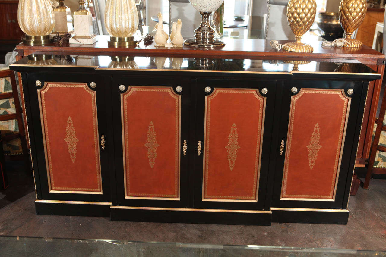 Sophisticated French Credenza, Signed Hirsch, Paris. 
This 4 door credenza/buffet is ebonized, and is made in Directoire style.