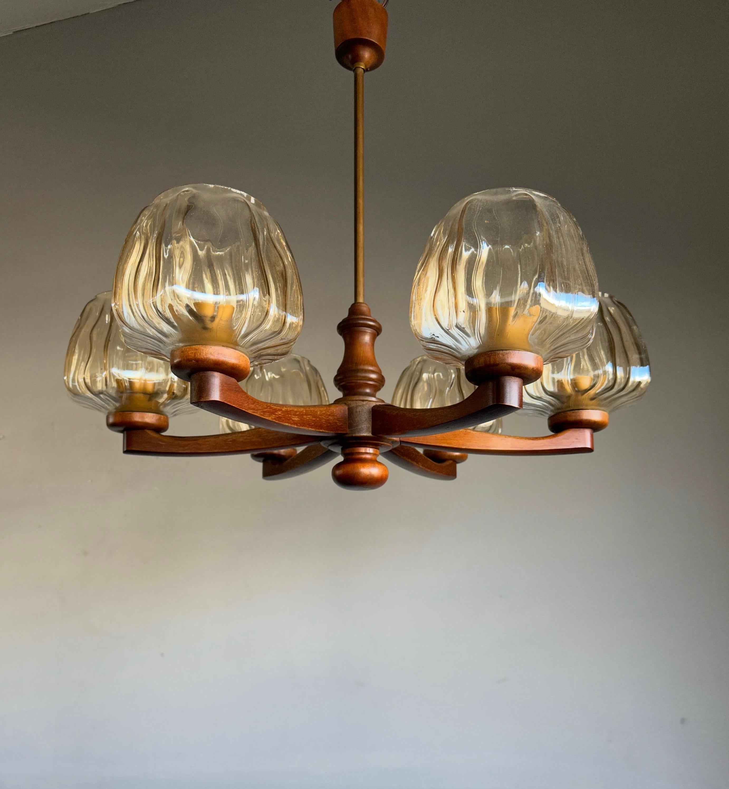 Beautiful and stylish pendant light from the heydays of the Scandinavian Design era. 

If you are looking for a rare and stylish chandelier to complement your midcentury or your contemporary interior then this handcrafted Scandinavian light