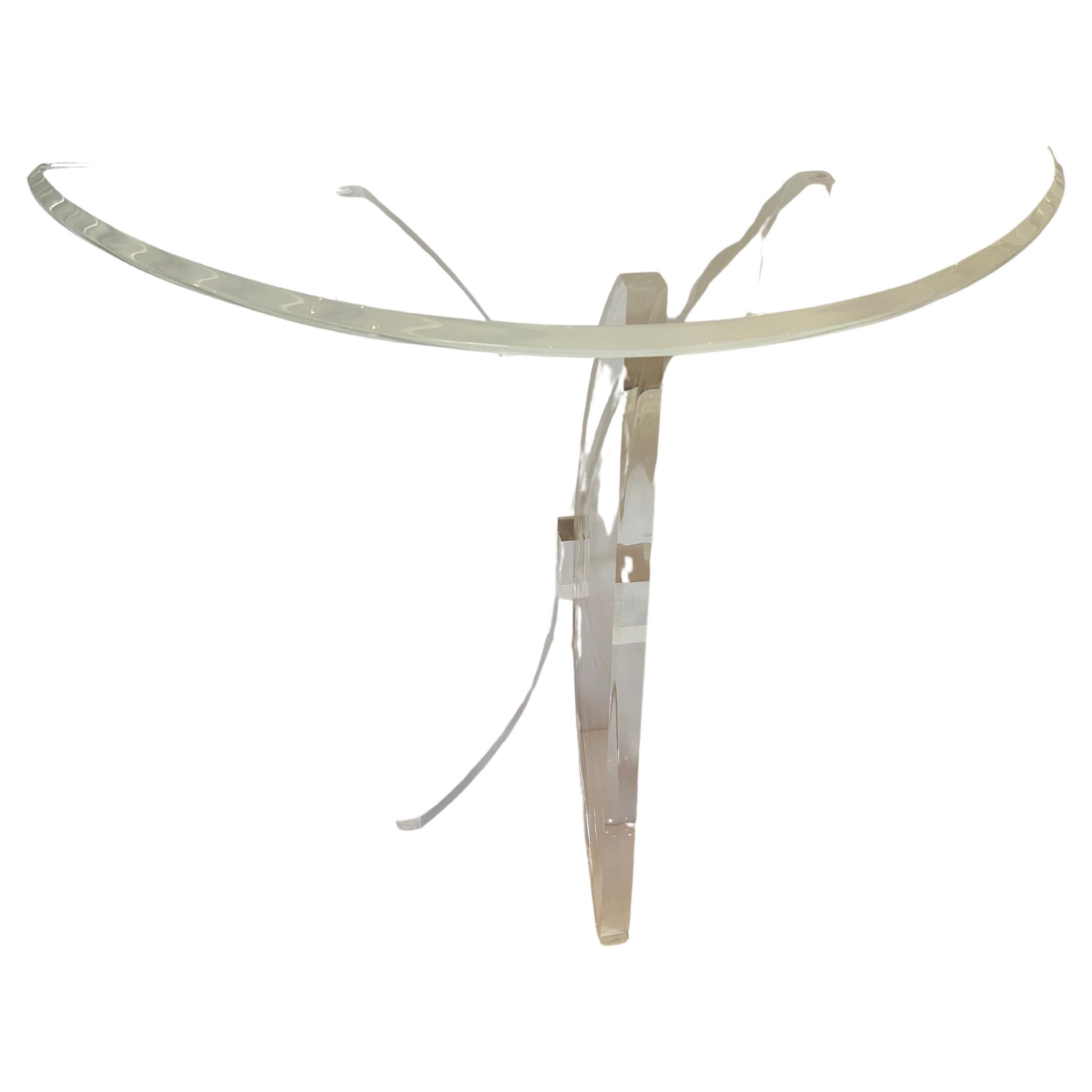 Super stylish lucite demilune console table having bevelled top and butterflyesque base.  Base has some weight to it.  Great shape!