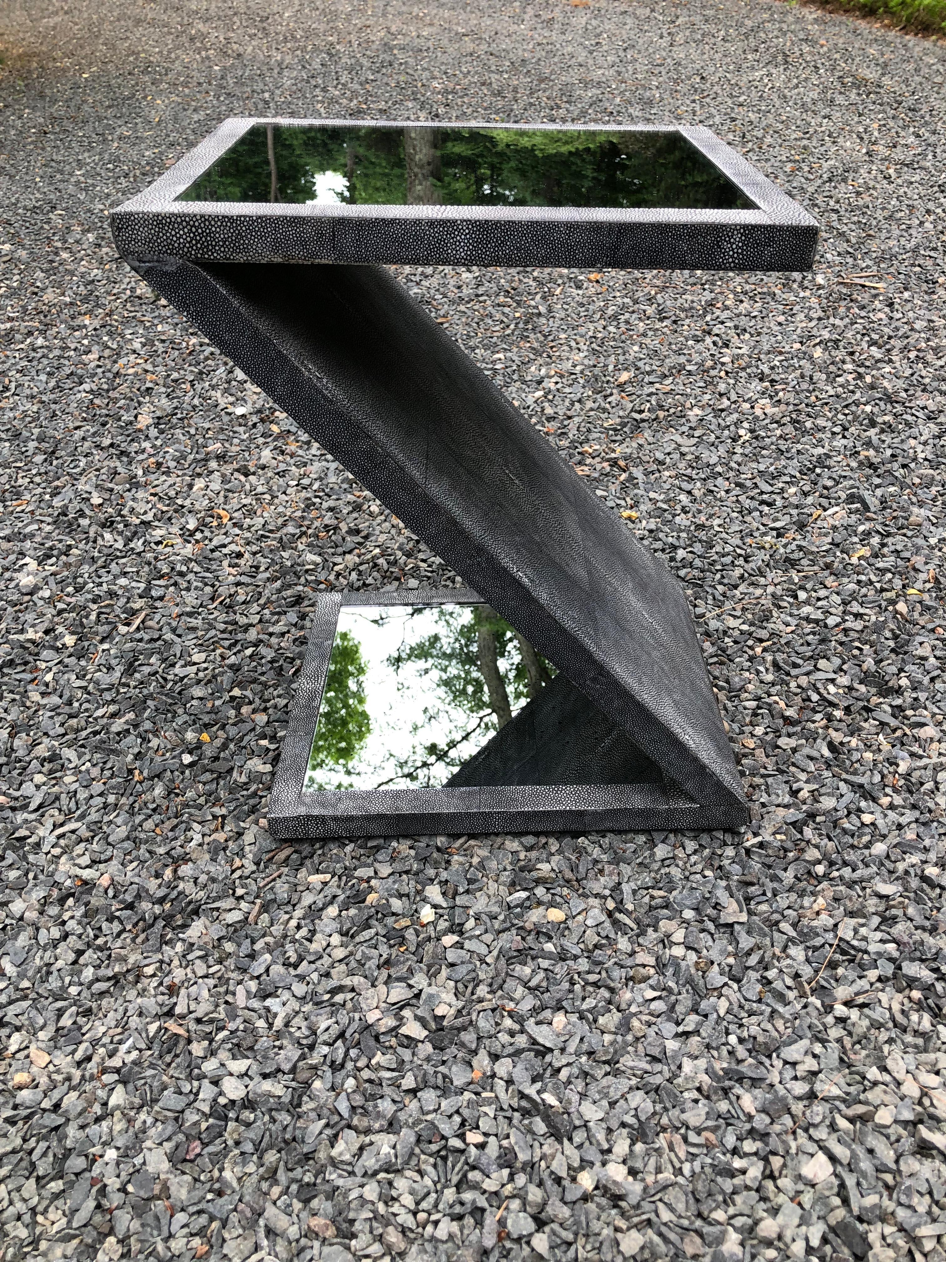 A sexy and sophisticated Z-form table constructed of faux shagreen and antiqued mirror. The grey faux shagreen is very authentic looking and frames the antiqued mirror top and base.